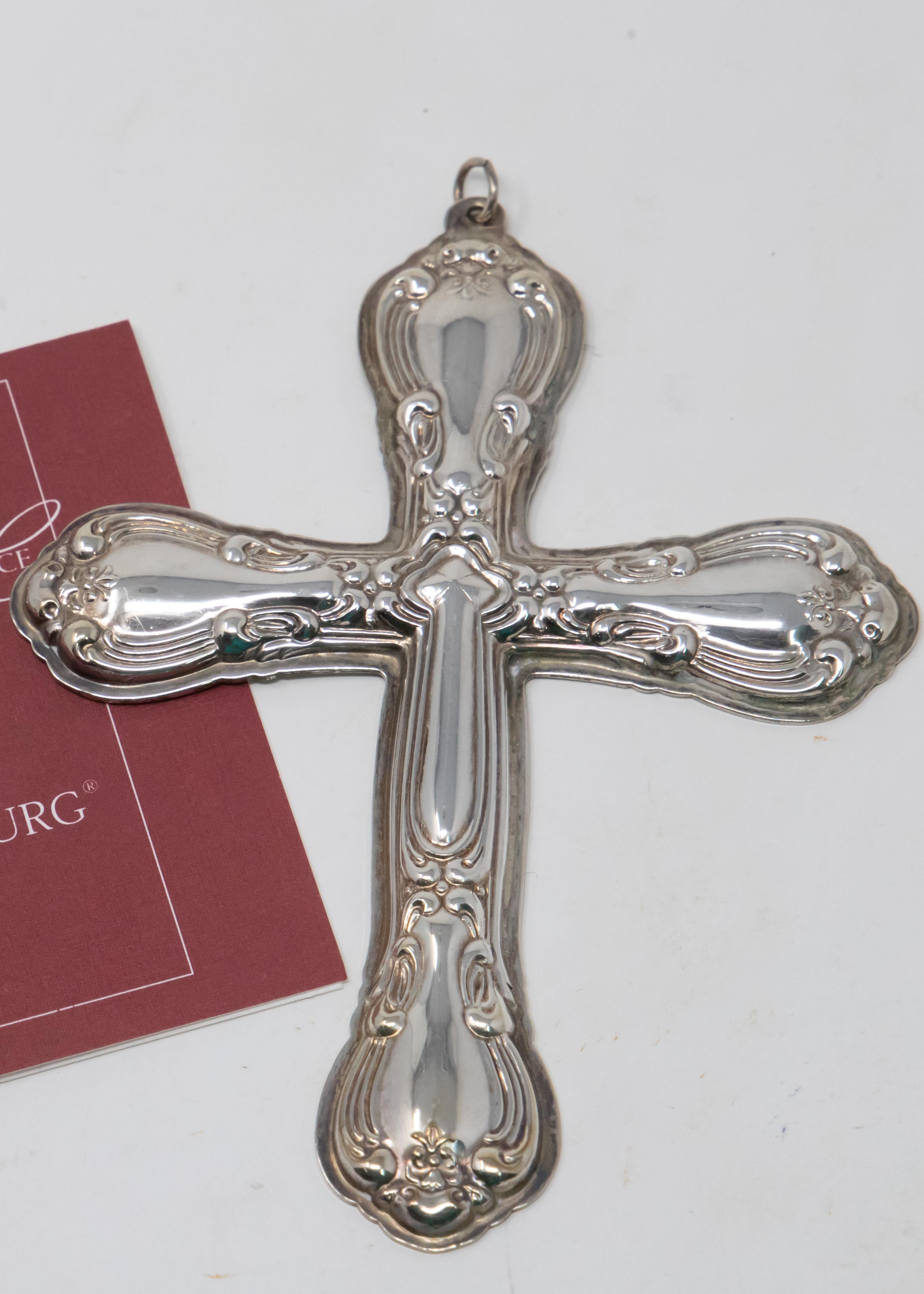 Offering this stunning Gotham Strasbourg Cross ornament from 1998. Having geometric foliate detail all around the outside edge of the piece. The back is matte finished and inscribed with Gorham Sterling, trademarks, Christmas, 1998.