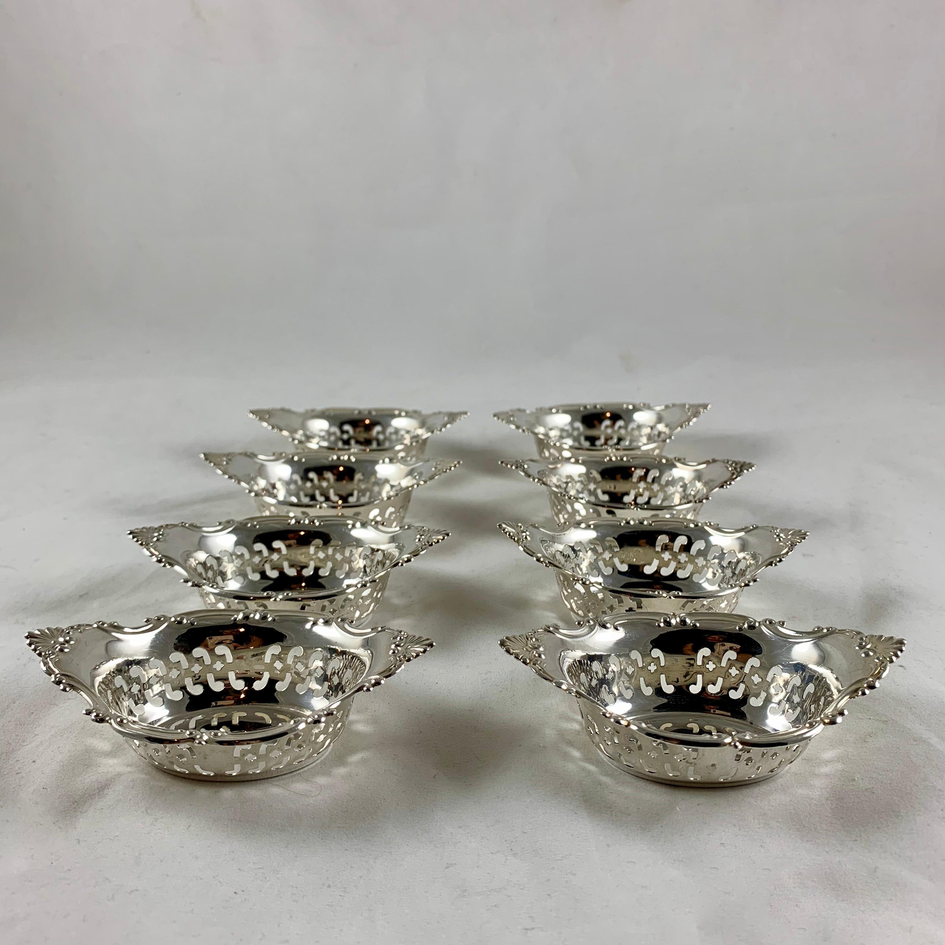 A set of eight sterling silver nut or candy cups in the Strasbourg pattern by Gorham, circa 1940s.

The pierced cups are meant to sit at each place setting filled with nuts, bon-bons, or mints. They make wonderful individual party favors, filled