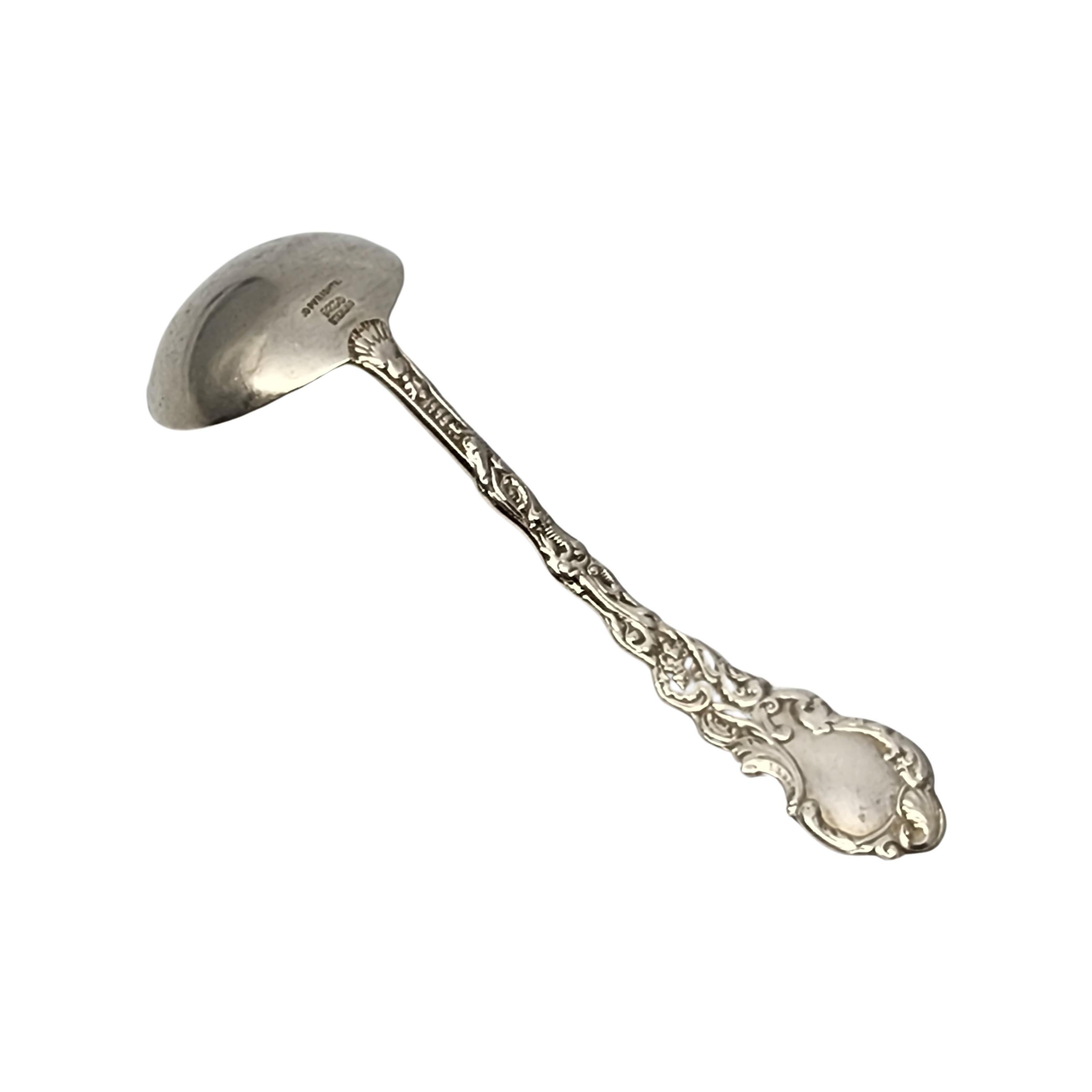 Sterling silver with gold wash bowl cream ladle by Gorham in the Versailles pattern.

No monogram

Gorham's Versailles is a multi motif pattern designed by Antoine Heller in 1885. Named for the Palace of Versailles, the pattern depicts ornate scenes