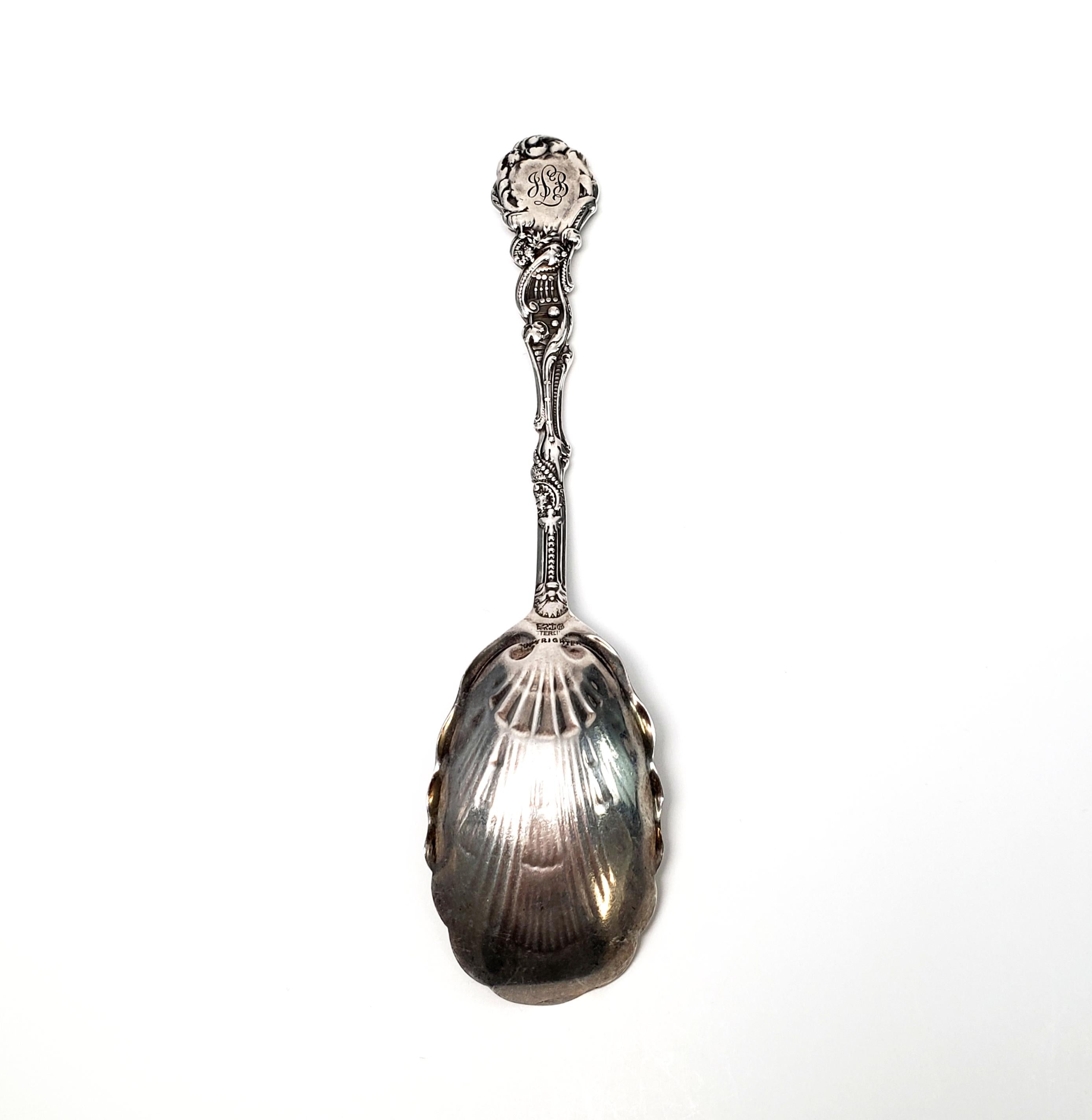 Antique sterling silver sugar shell spoon by Gorham in the Versailles pattern with a gold washed bowl, with monogram.

Gorham's Versailles is a multi motif pattern designed by Antone Heller in 1885. Named for the Palace of Versailles, the pattern