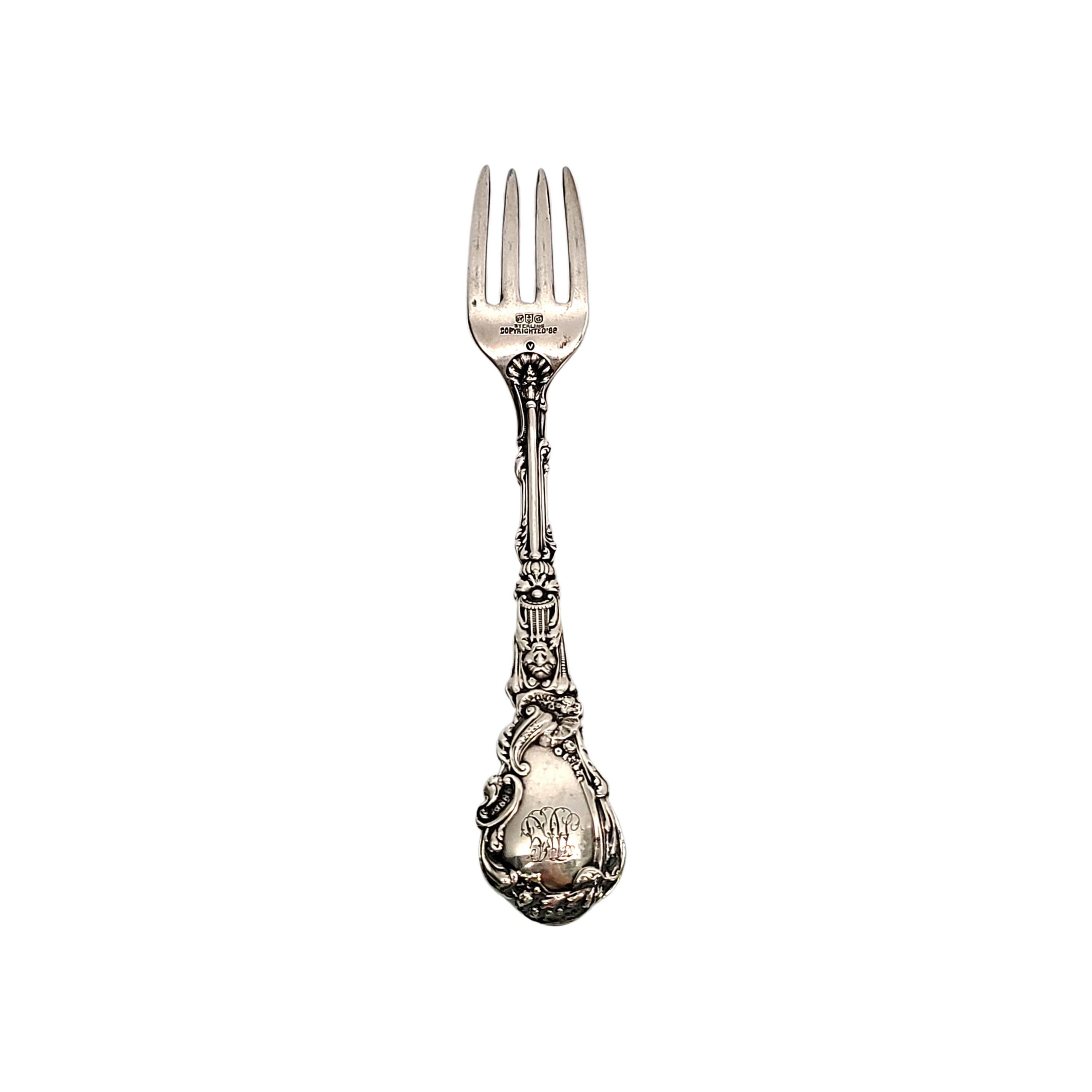 Antique sterling silver luncheon fork by Gorham in the Versailles pattern.

Monogram on the top back of each handle appears to be HJG

Gorham's Versailles is a multi motif pattern designed by Antone Heller in 1885. Named for the Palace of