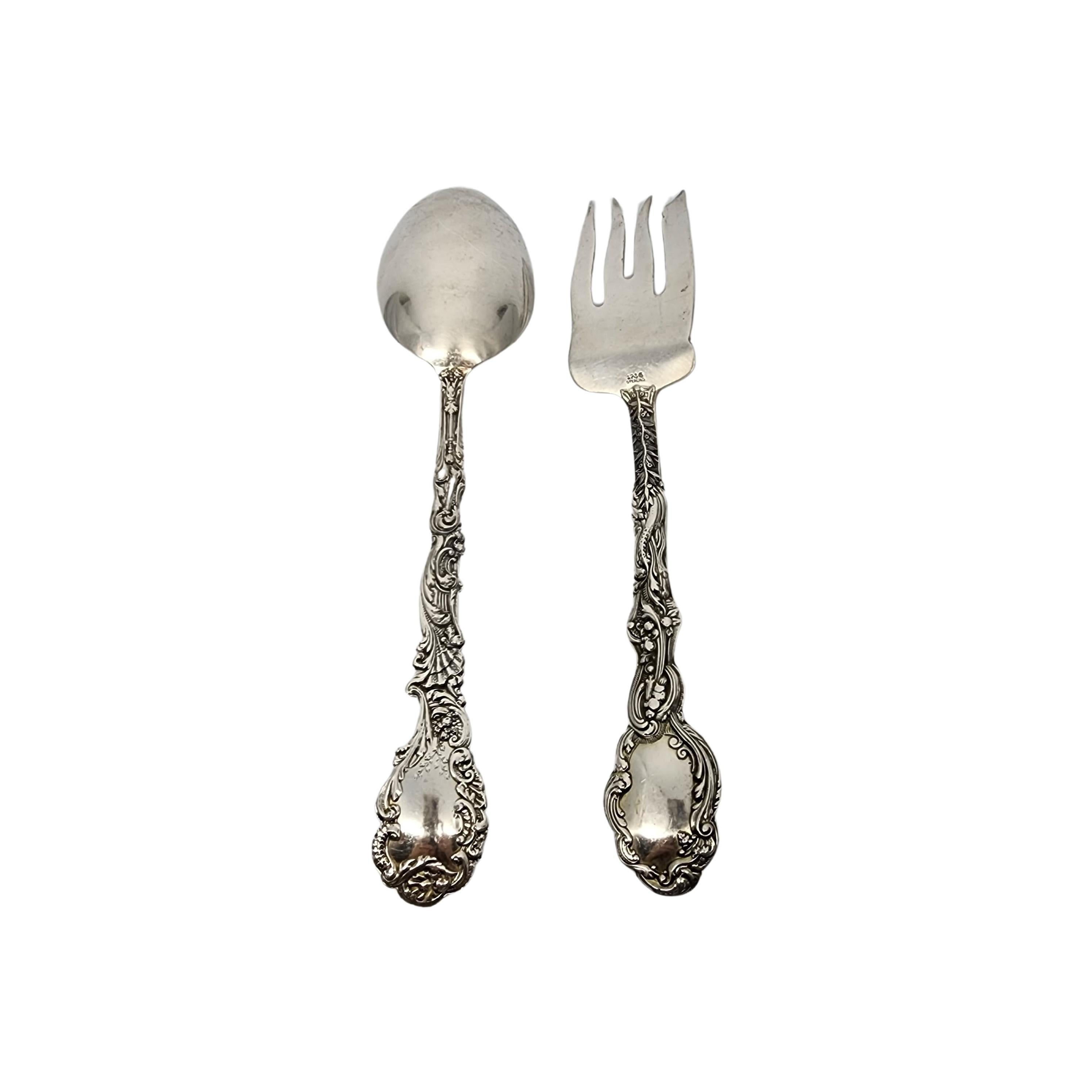 Sterling silver cold meat serving fork and serving tablespoon by Gorham in the Versailles pattern.

No monogram.

Gorham's Versailles is a multi motif pattern designed by Antoine Heller in 1885. Named for the Palace of Versailles, the pattern