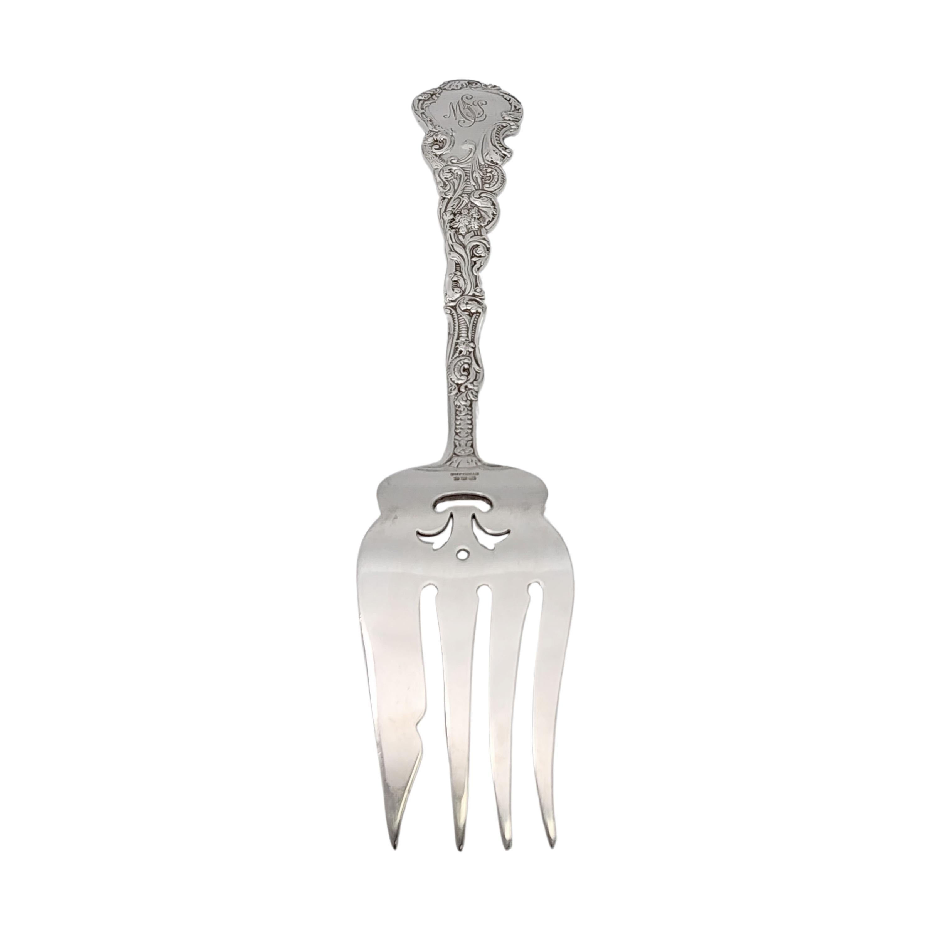 Sterling silver small cold meat serving fork in the Versailles pattern by Gorham.

Monogram appears to be MSJ (see photo).

Gorham's Versailles is a multi motif pattern designed by Antoine Heller in 1885. Named for the Palace of Versailles, the