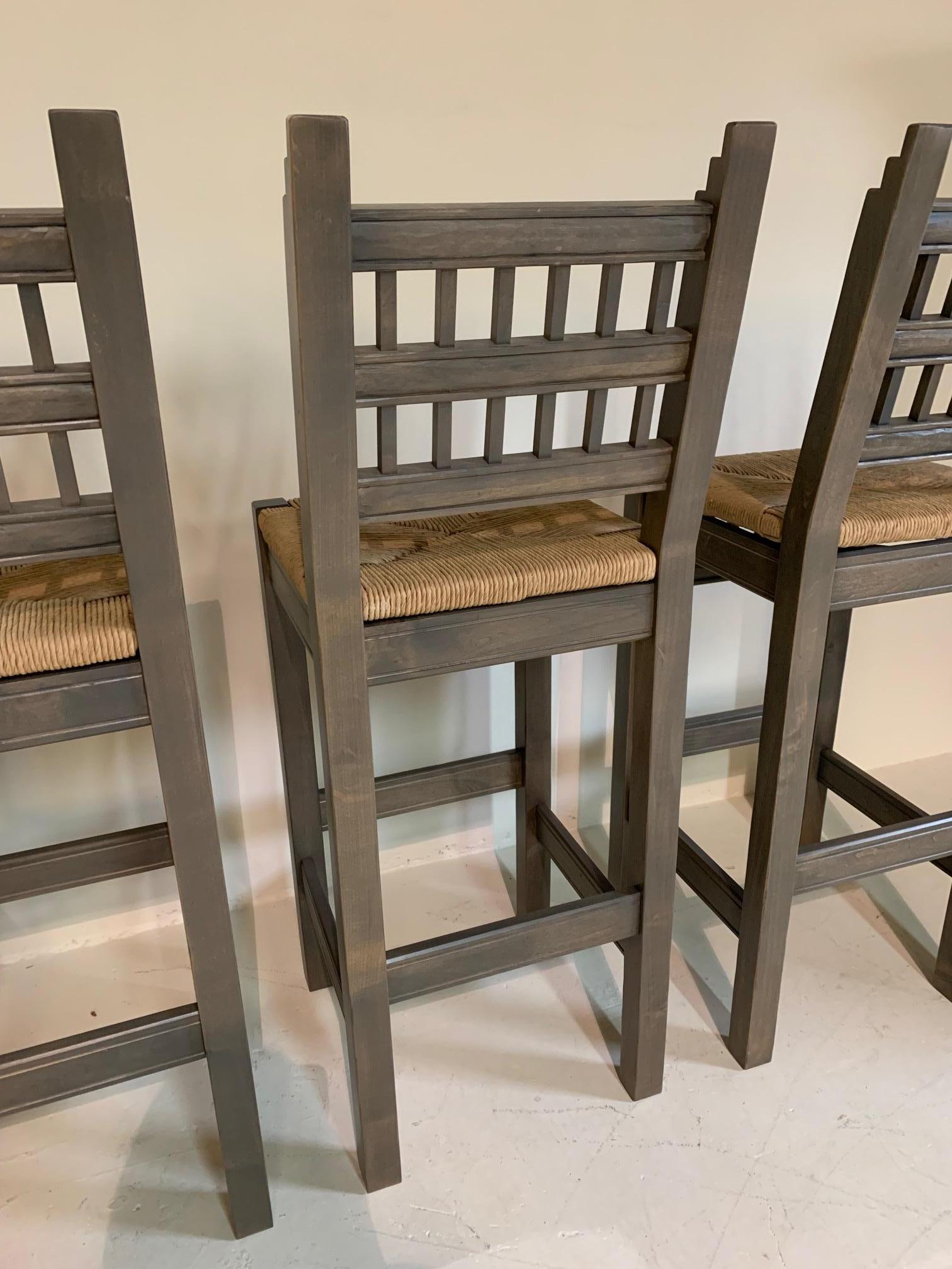 Beautiful barstools in a soft charcoal stain, handcrafted in Albuquerque, New Mexico with rush seats. Sold as a set of 3.3,300