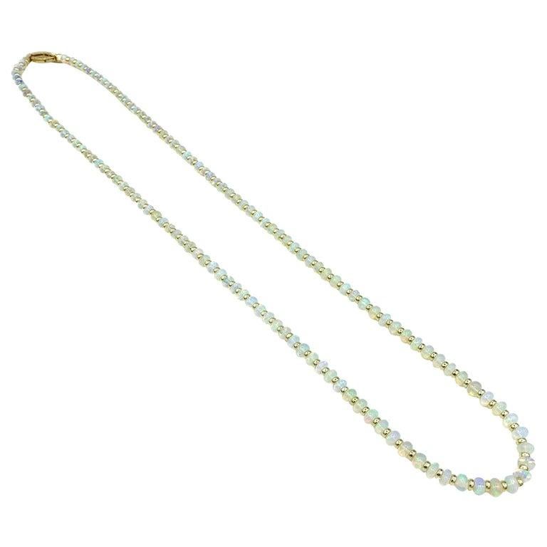 1 strand Opal Bead Necklace with Rondelles in 18K Yellow Gold 

Approx. Length: 28