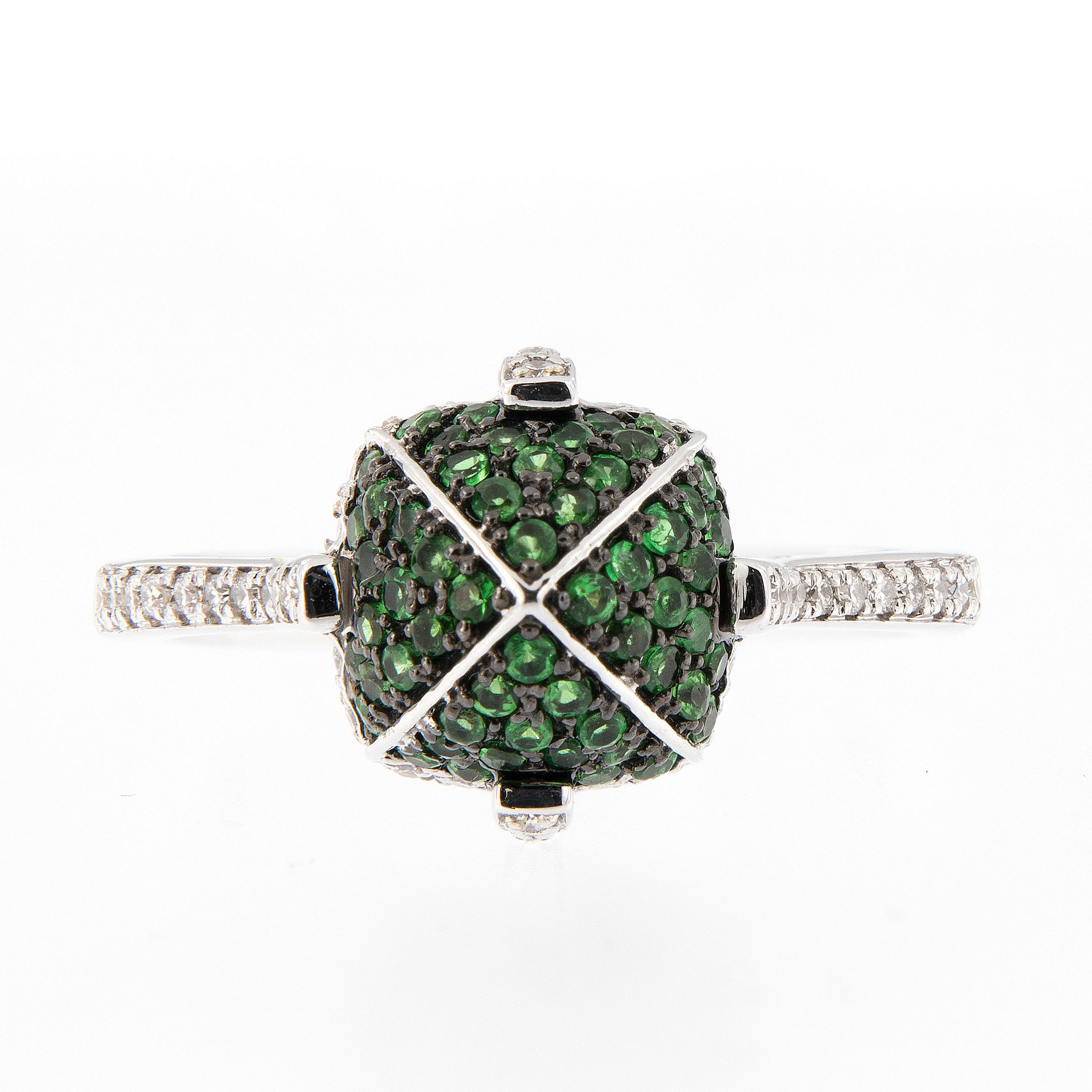 Striking 18k white gold sugarloaf design ring pave set with tsavorites and accented with diamonds. Designed by Goshwara from New York. Ring size 6.5. Top of ring measures 9mm x 9mm. Marked Goshwara

Tsavorite 0.42 cttw
Diamond 0.19 cttw