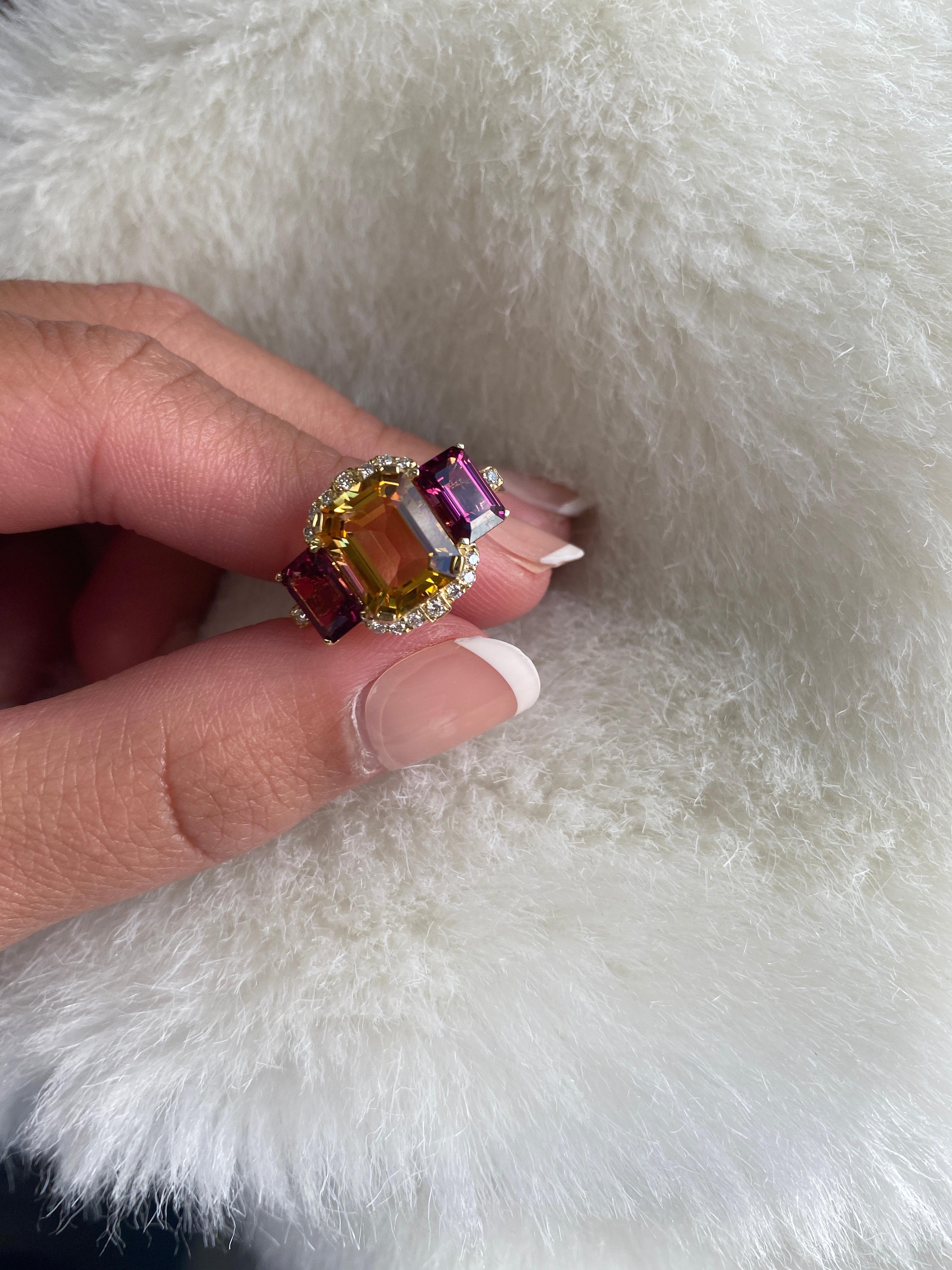 A perfect combination of Citrine and Garnet is this 3 Stone Emerald Cut Ring with Diamonds set in 18K Yellow Gold. From our popular 'Gossip' Collection, this piece carries a hint of shock value.

* Stone Size: 10 x 8 - 7 x 5 mm
* Gemstone: 100%