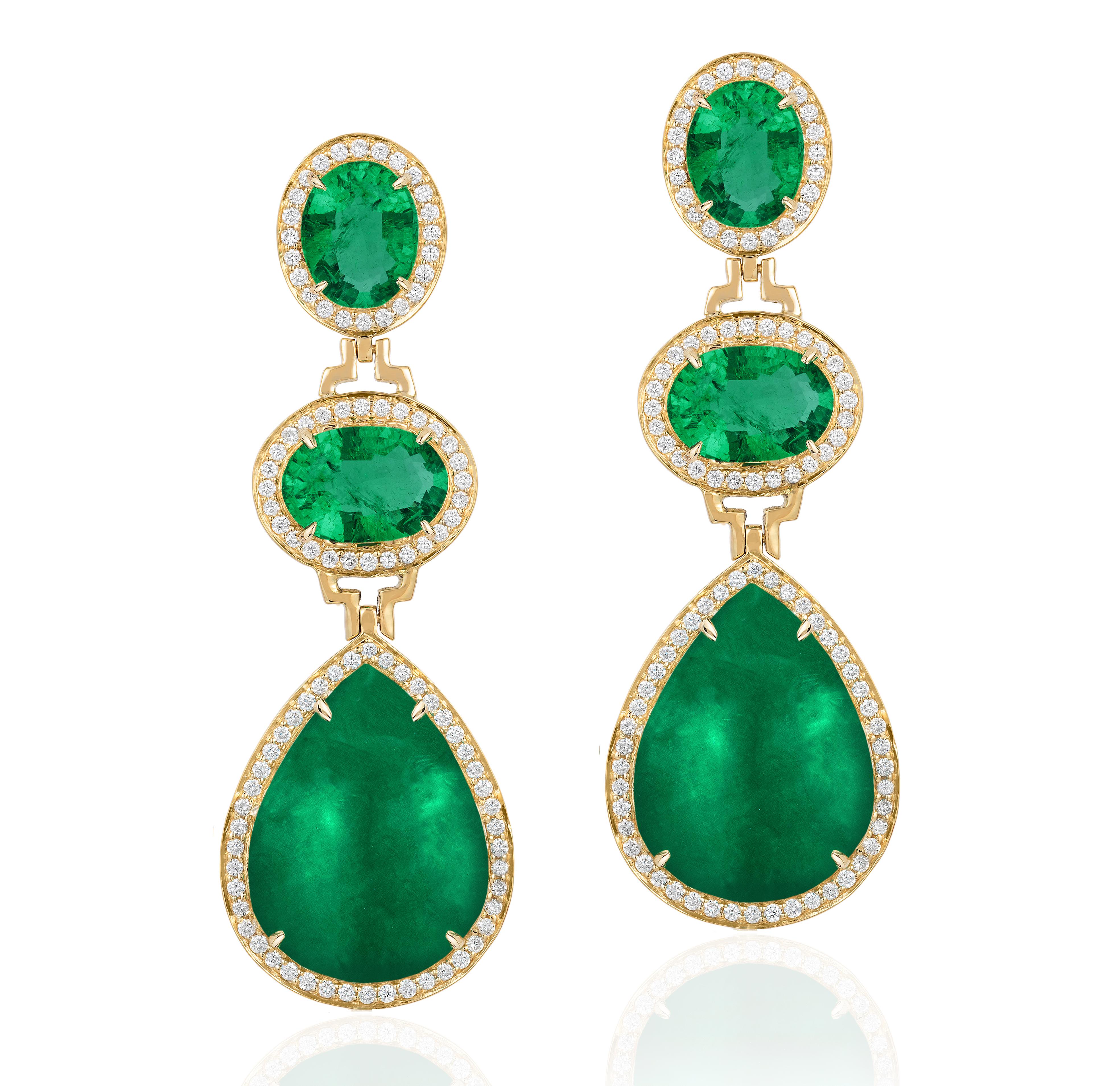These 3 Tier Faceted Oval and Pear Shape Emerald Drop Earrings with Diamonds are exquisite pieces of jewelry from the luxurious 'G-One' Collection. Crafted in 18K yellow gold, these earrings are a stunning blend of elegance and sophistication. The