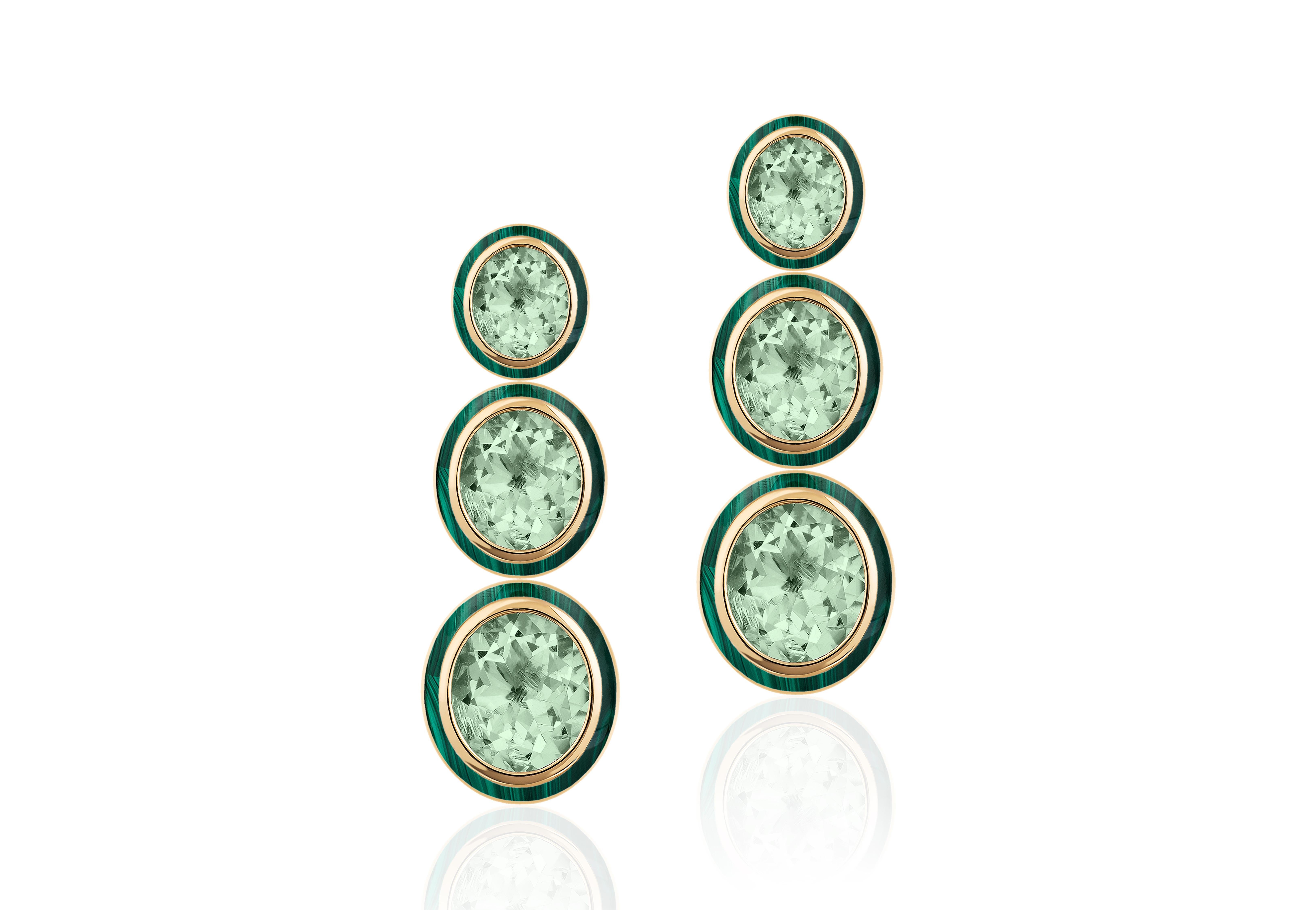 These 3 tier Oval Shape Prasiolite & Malachite Earrings in 18K Yellow Gold are an exquisite piece of jewelry from the 'Melange' Collection. The earrings feature three tiers of oval-shaped Prasiolite gemstone with Malachite border. The gemstones are