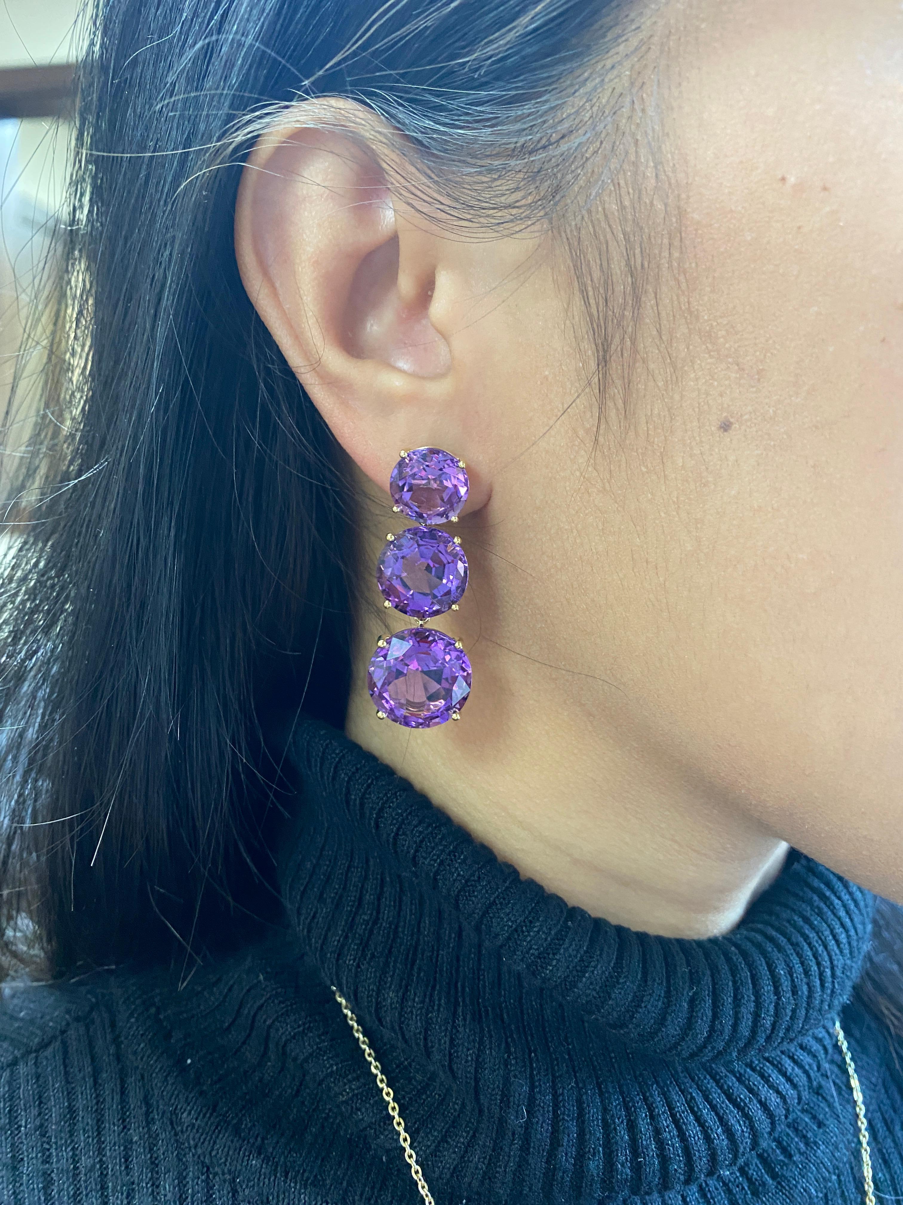3 Tier Round Faceted Amethyst Earrings in 18k Yellow Gold, from ‘Gossip' Collection.  Like any good piece of gossip, this piece carries a hint of shock value.

* Gemstone size: 15, 13 & 11 mm
* Gemstone: 100% Earth Mined 
* Approx. gemstone Weight: