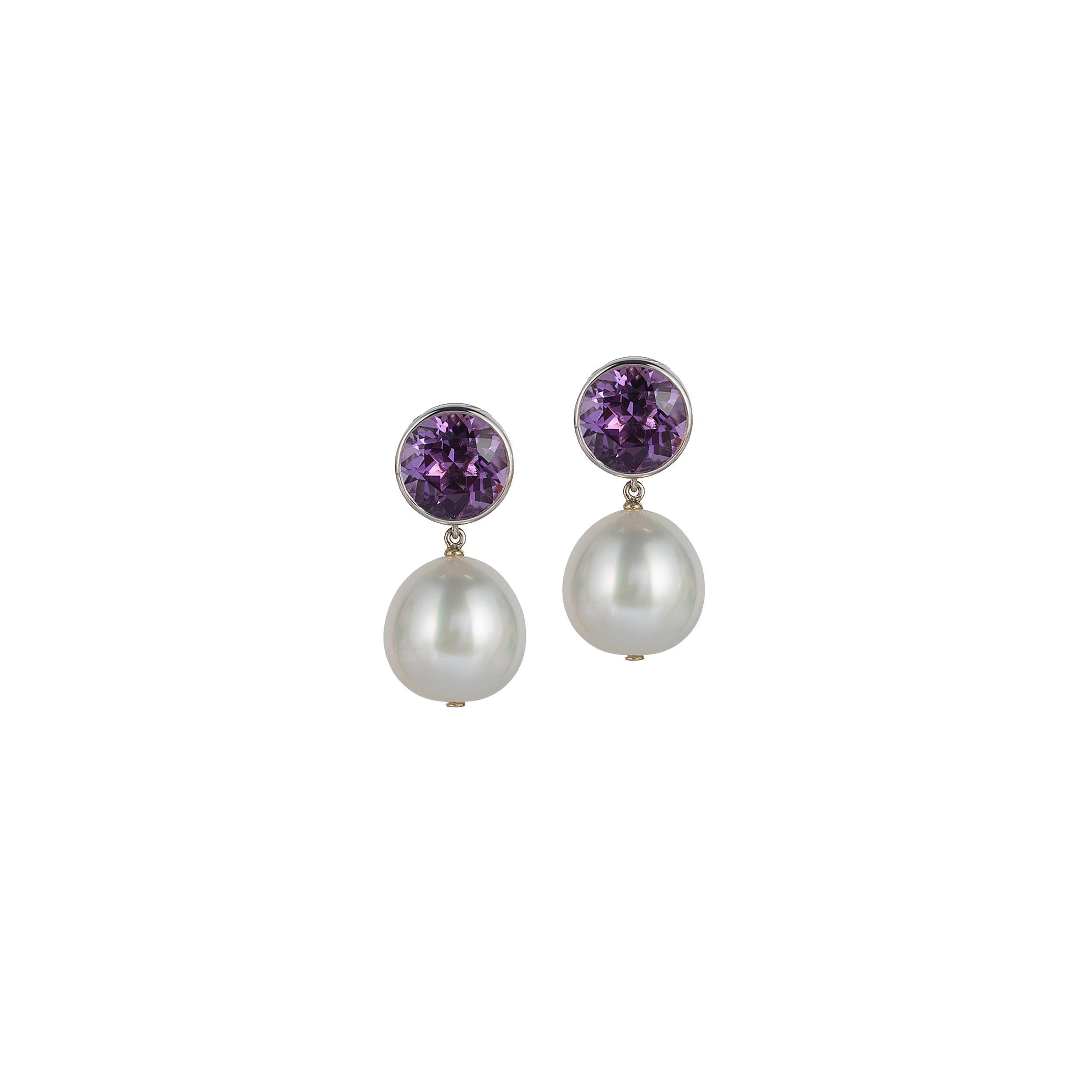 Bezel Set Round Amethyst Stud Earrings with White South Sea Pearls and Omega Clip, in 18K Yellow Gold, From 'Gossip' Collection
 
 Stone Size: 10 mm 
 
 Gemstone Weight: Blue Topaz- 6.80 Carats