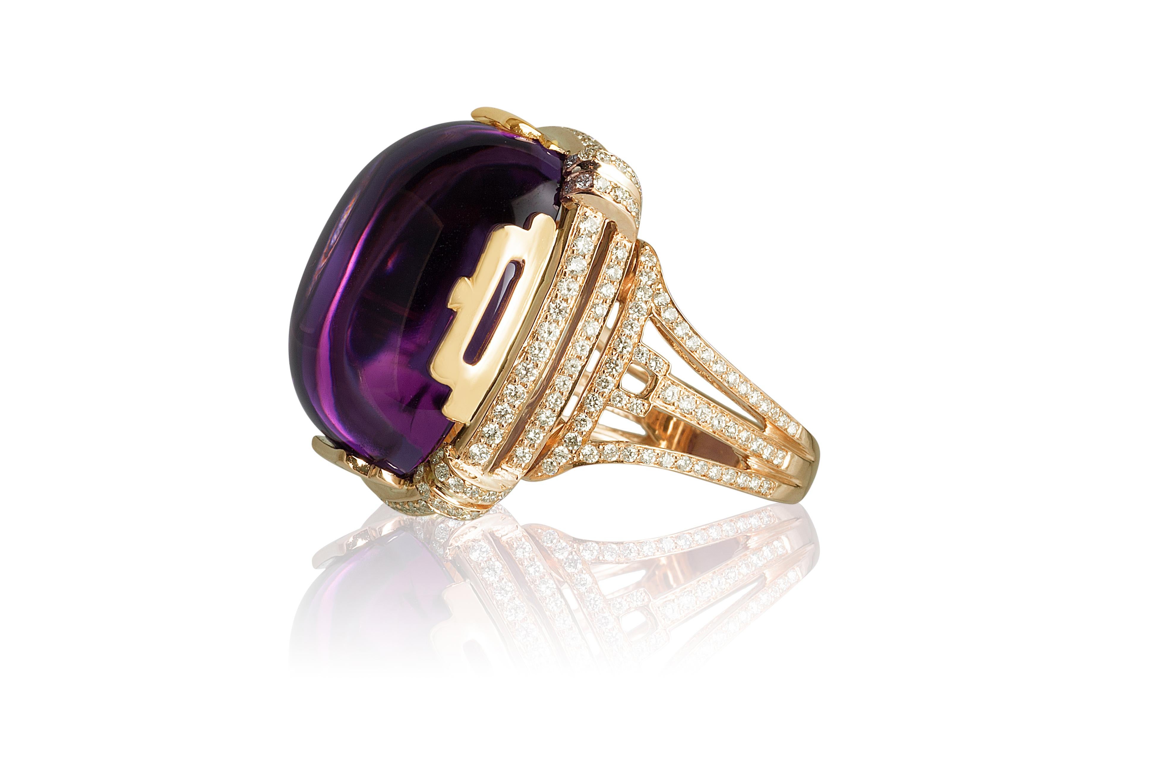 Amethyst Large Cushion Cabochon Ring with Diamonds in 18K Yellow Gold, from 'Rock 'N Roll' Collection

Stone Size: 21.50 x 19.50 mm

Gemstone Approx. Wt: Amethyst- 32.25 Carats

Diamonds: G-H / VS, Approx. Wt: 1.00 Carats