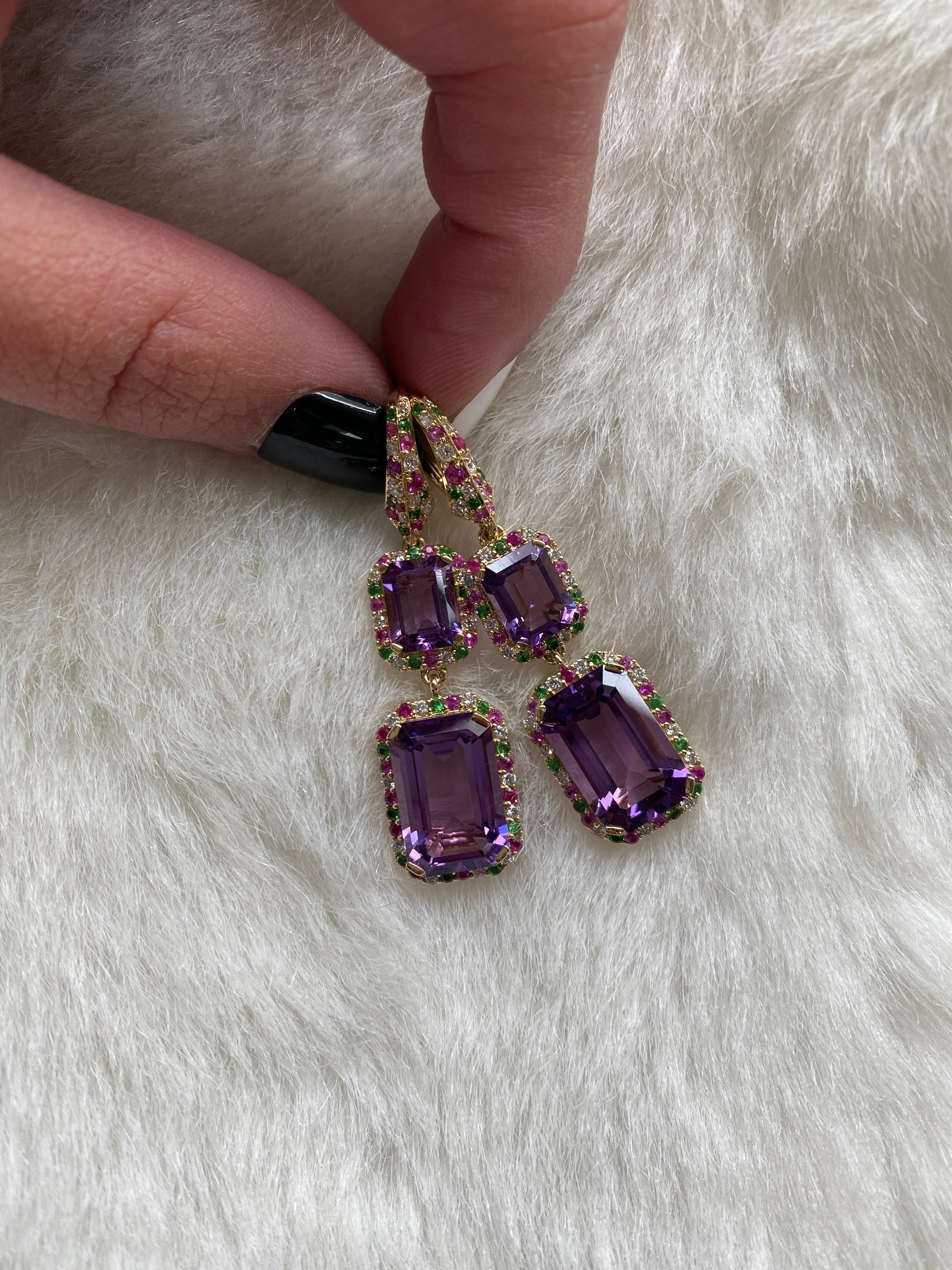 Amethyst Emerald Cut Earrings with Tsavorite, Sapphire and Diamonds in 18k Yellow Gold, from 'Rain Forest' Collection.

This collection is thriving with luxuriant center stones and colored pave that represent the rain and the forest together. Blue