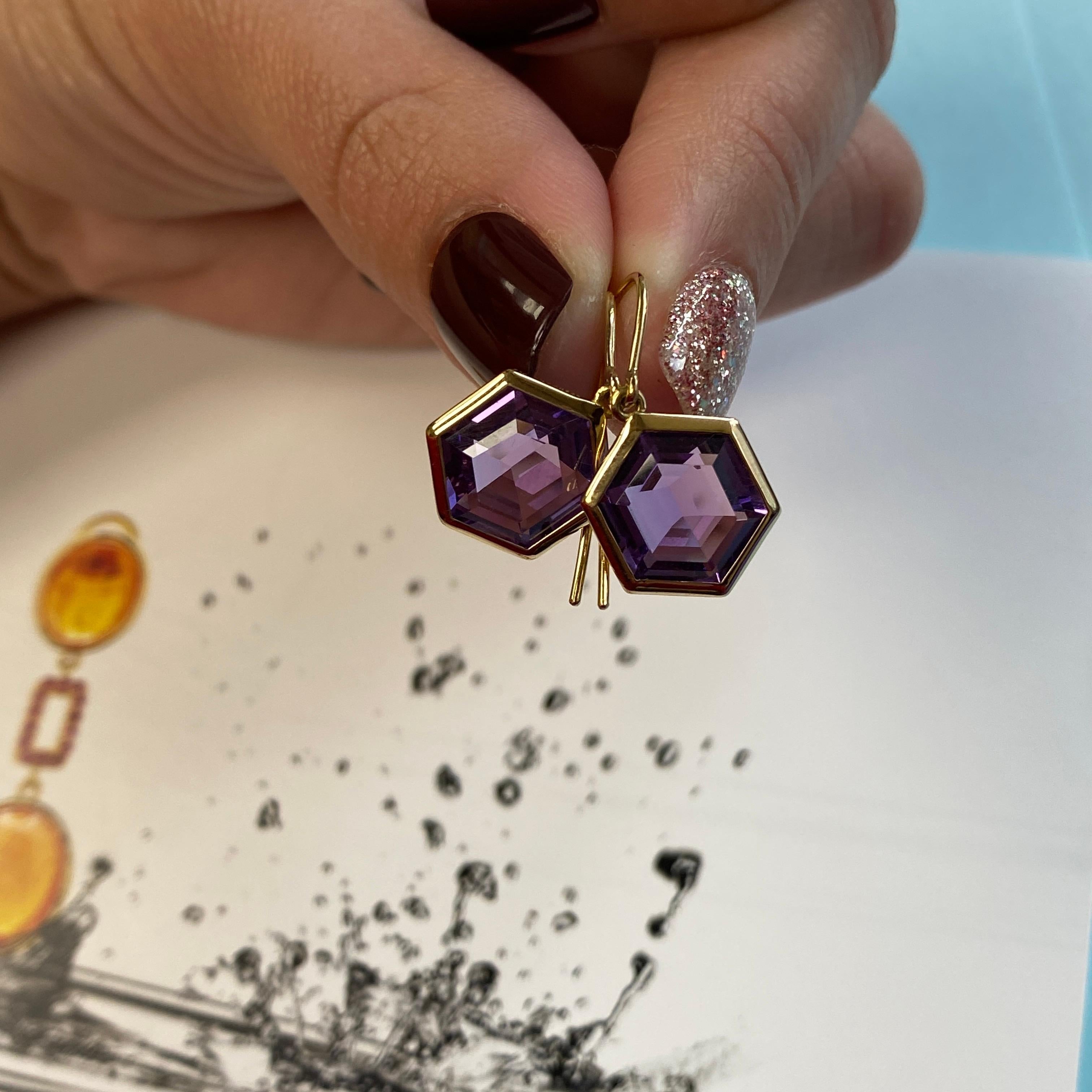 Elevate your style with these exquisite earrings featuring a stunning 12 x 10 mm Hexagon gemstone. Expertly set on a delicate wire of 18K Gold, Their versatile design seamlessly transitions from a chic daytime accessory to an elegant statement piece