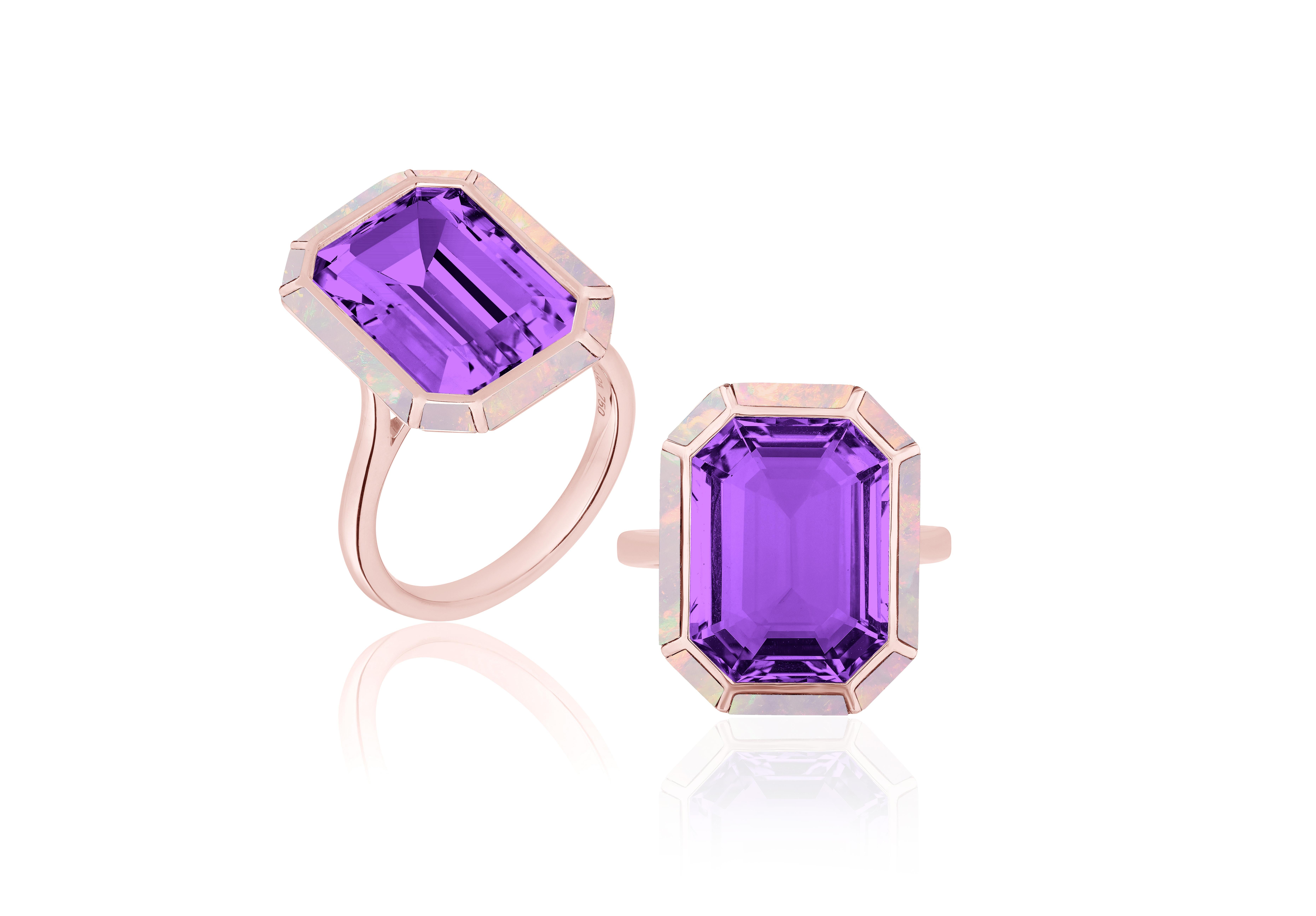 This Amethyst & Pink Opal Emerald Cut Ring is a stunning piece of jewelry from the 'Melange' Collection, crafted in 18K Rose Gold. The ring features a beautiful emerald-cut Amethyst stone with a Pink Opal stone border. The combination of the rich