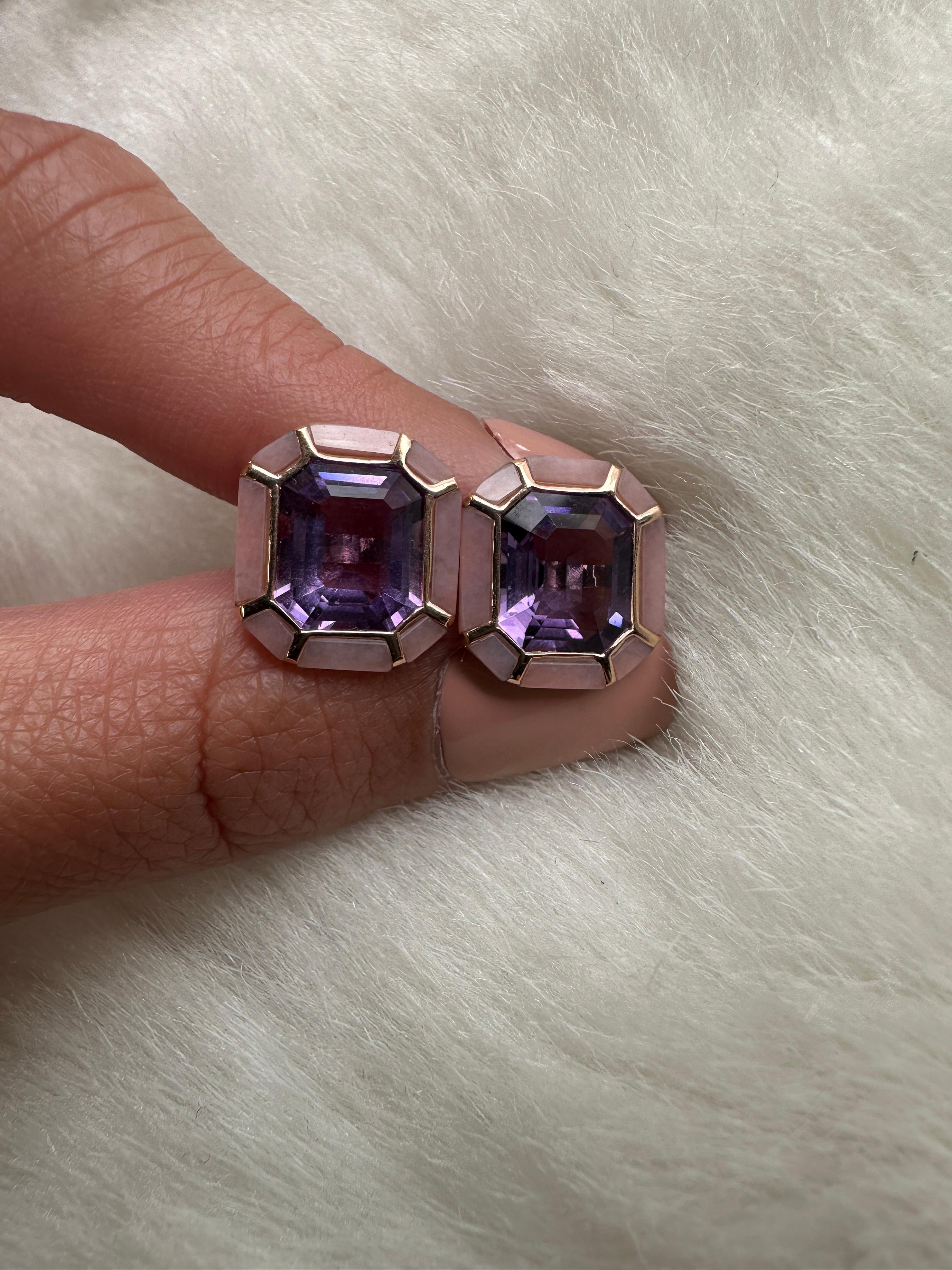 The Amethyst & Pink Opal Stud Earrings from the 'Melange' Collection showcase a captivating blend of elegance and charm. Crafted with exquisite attention to detail, these earrings feature stunning emerald cut amethyst and pink opal gemstones set in