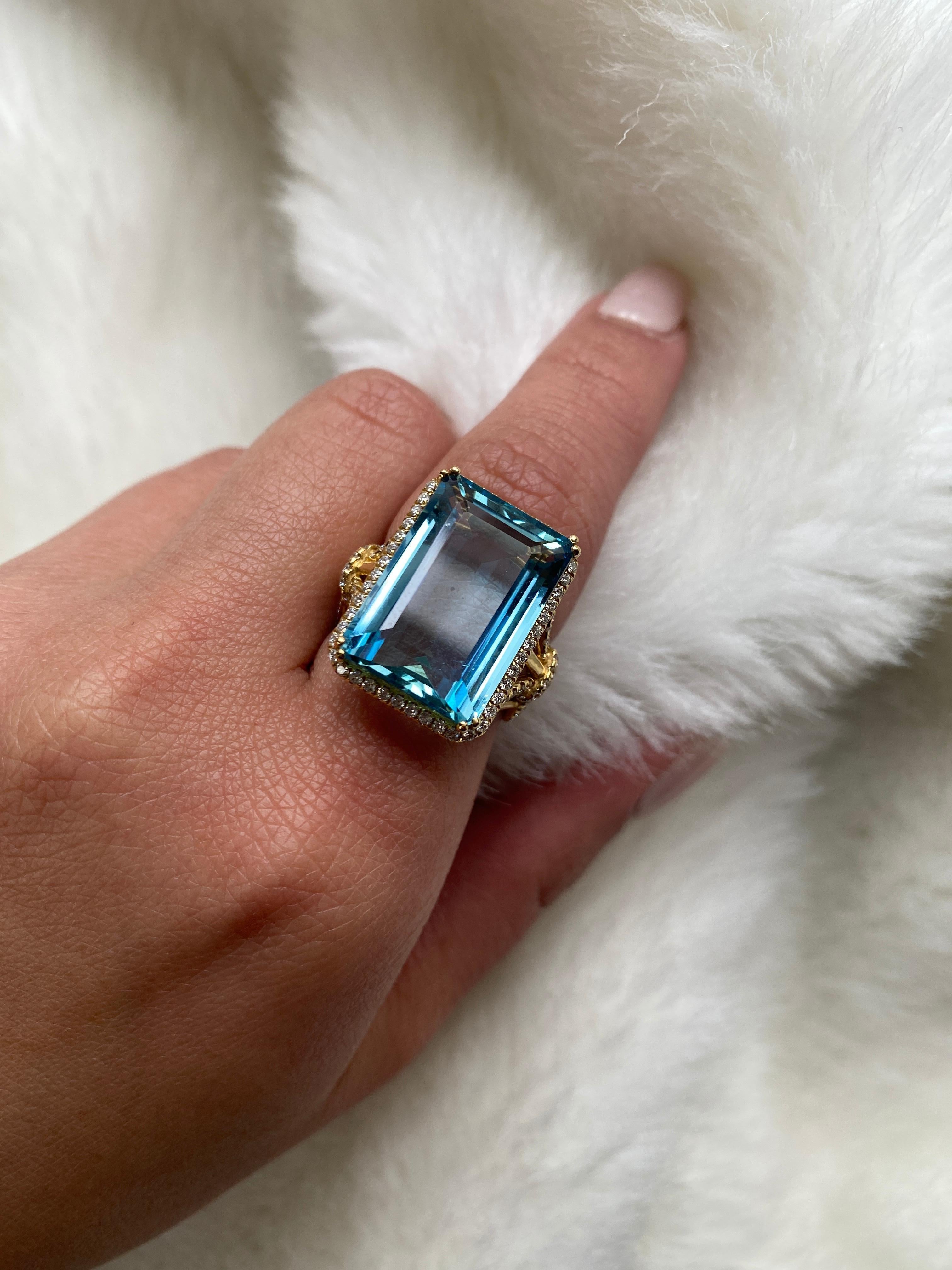 Aqua Emerald Cut Ring with Diamonds in 18K Yellow Gold, from 'G-One' Collection.

Approx. Stone Weight: 14.14 Carats (Aqua)

Diamonds: G-H / VS, Approx. Wt: 0.74 Carats