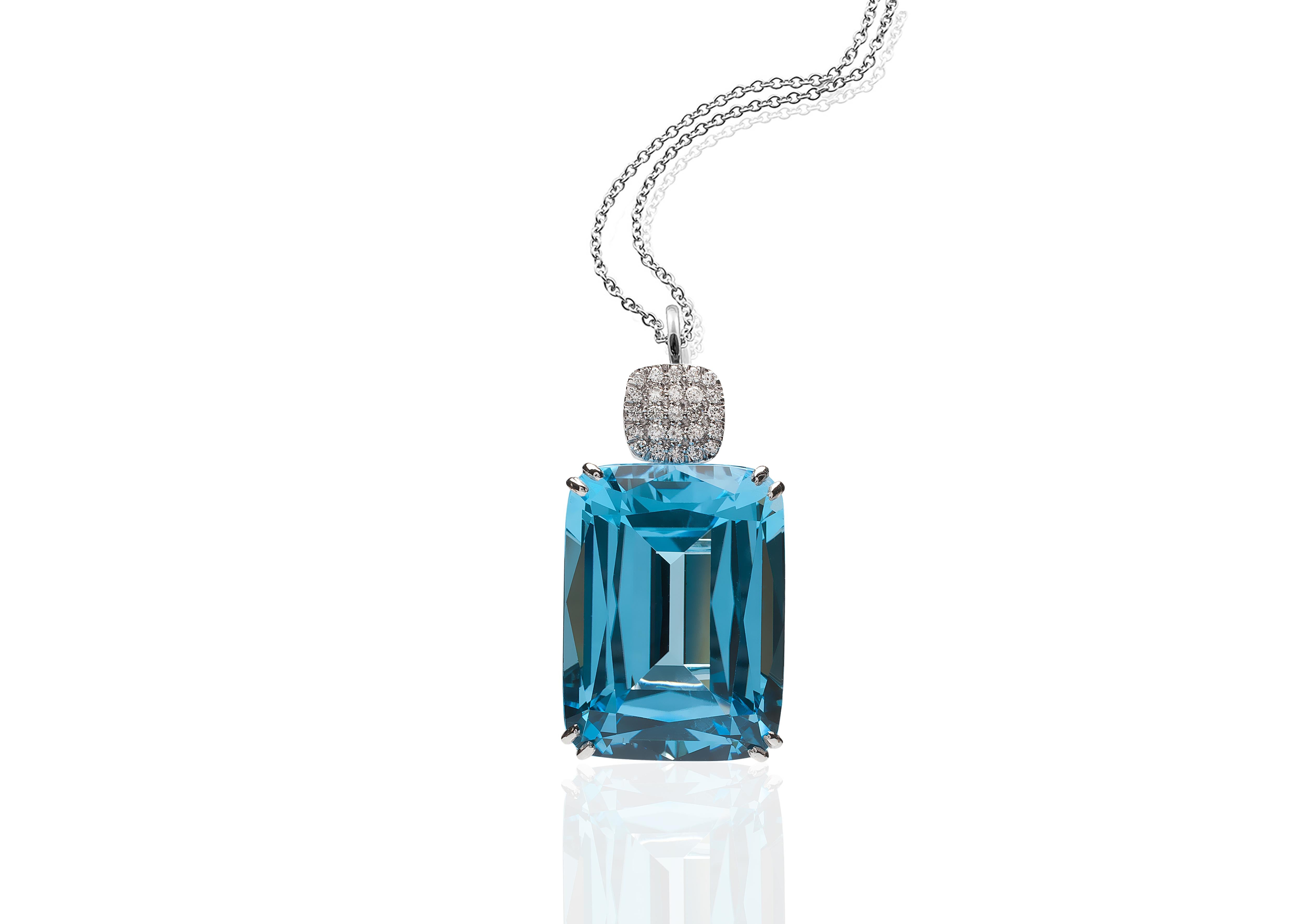 Blue Topaz Cushion Pendant in 18K White Gold with Diamonds on an 18'' Chain from 'Gossip' Collection

 Stone Size: 15 x 20 mm

Gemstone Approx Wt: Blue Topaz- 28.23 Carats

 Diamonds: G-H / VS, Approx Wt: 0.18 Carats