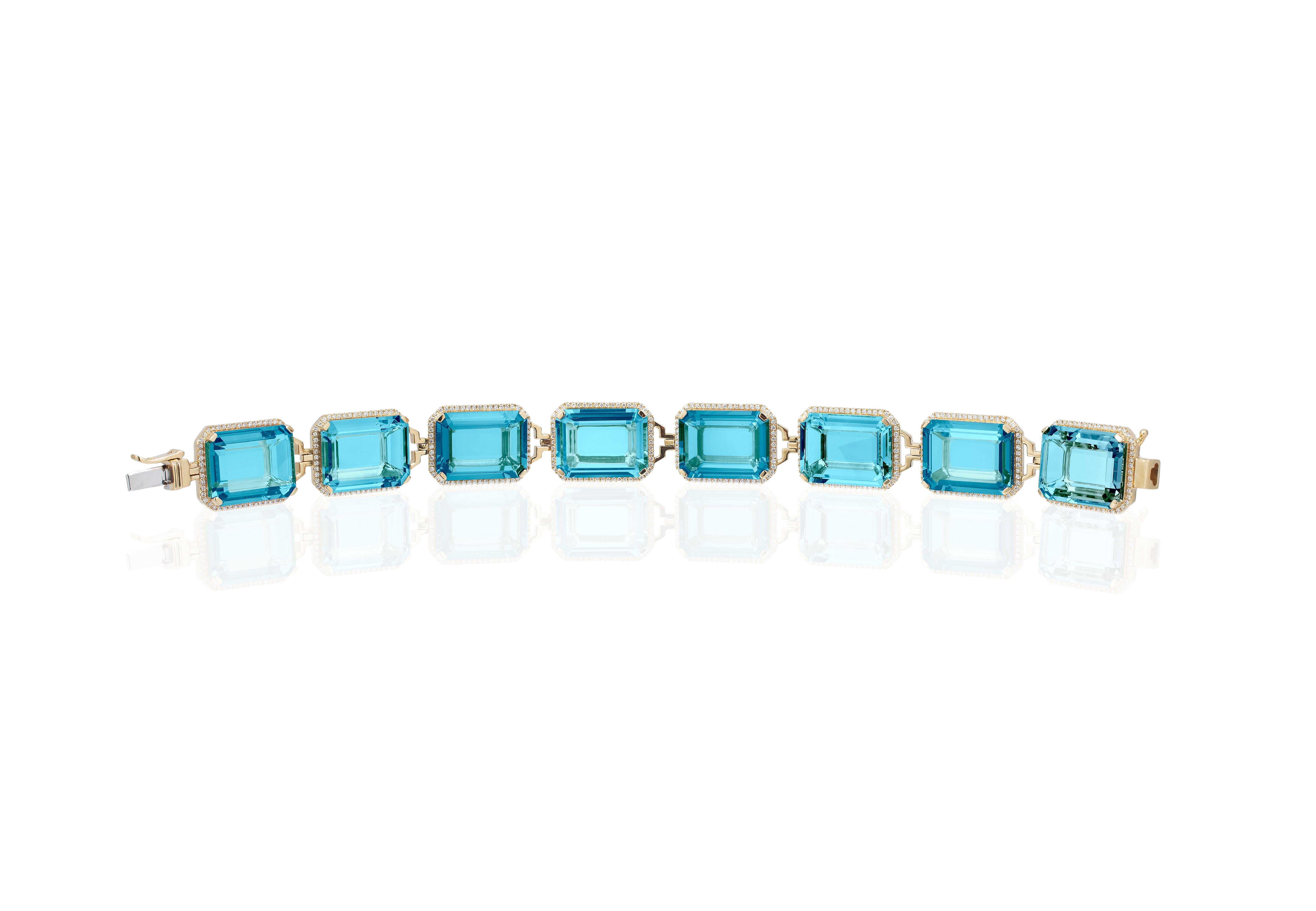 Blue Topaz Emerald Cut Bracelet with Diamonds in 18K Yellow Gold from ’Gossip’ Collection

 *Bracelet Length: 6 3/4'' 
  (The size can be adjusted as per request)
 *Gemstone Size: 16 x 12 mm 

 *Approx Carat: 1.25 Carat (Diamonds)
 *Diamond: G/H
