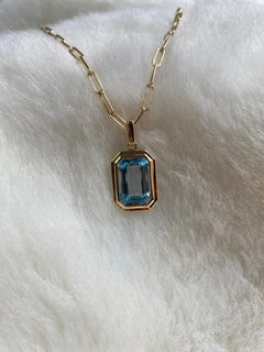 Goshwara Blue Topaz Emerald Cut Bezel Set Pendant