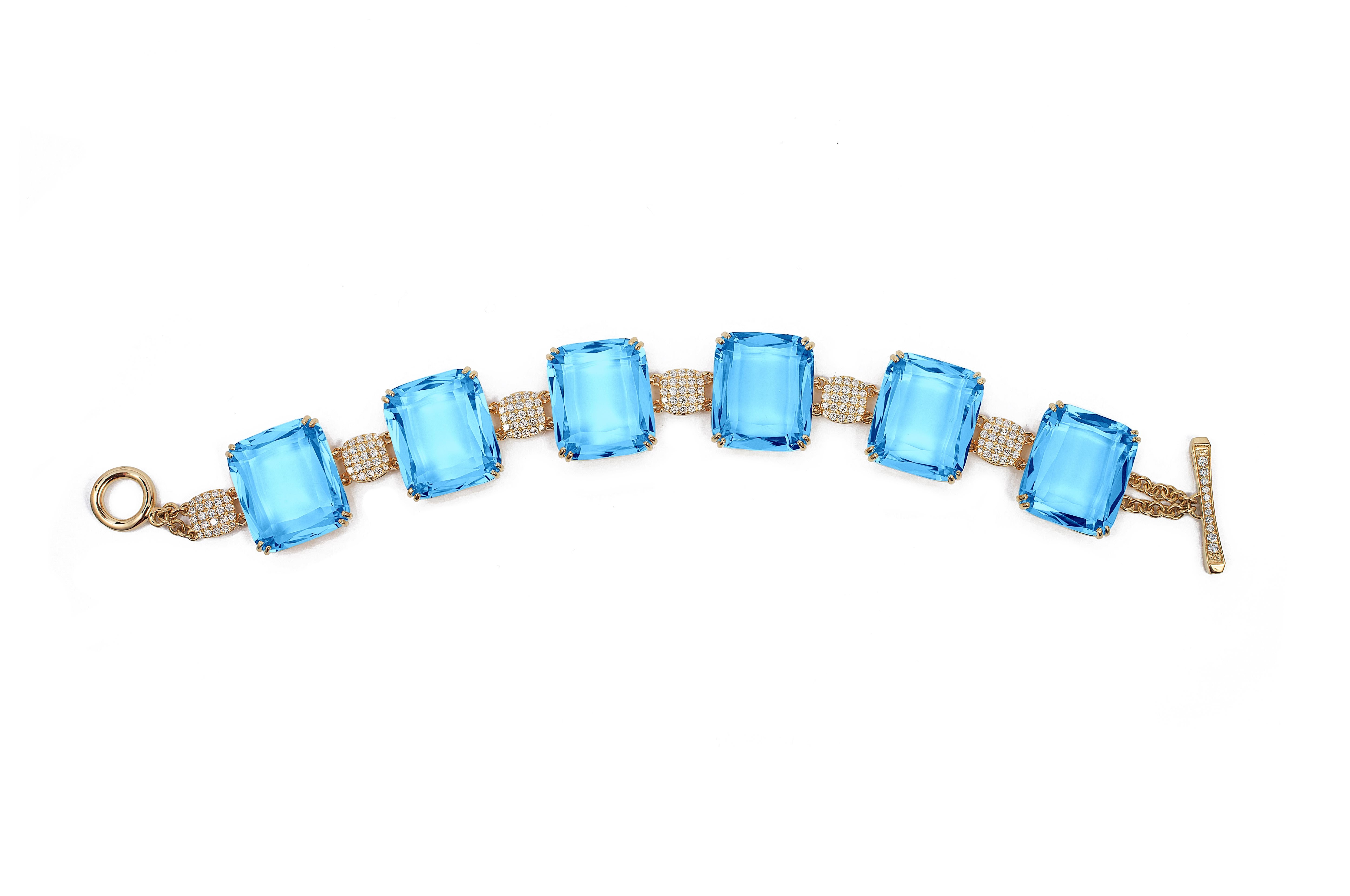 Blue Topaz Faceted Flat Cushion Bracelet with Diamonds in 18K Yellow Gold, from 'Gossip' Collection
 Bracelet Length: 6 3/4''
 Stone Size: 19 x 16 mm
 Gemstone Approx. Wt: Blue Topaz- 148.91 Carats
 Diamonds: G-H / VS, Approx. Wt: 1.69 Carats