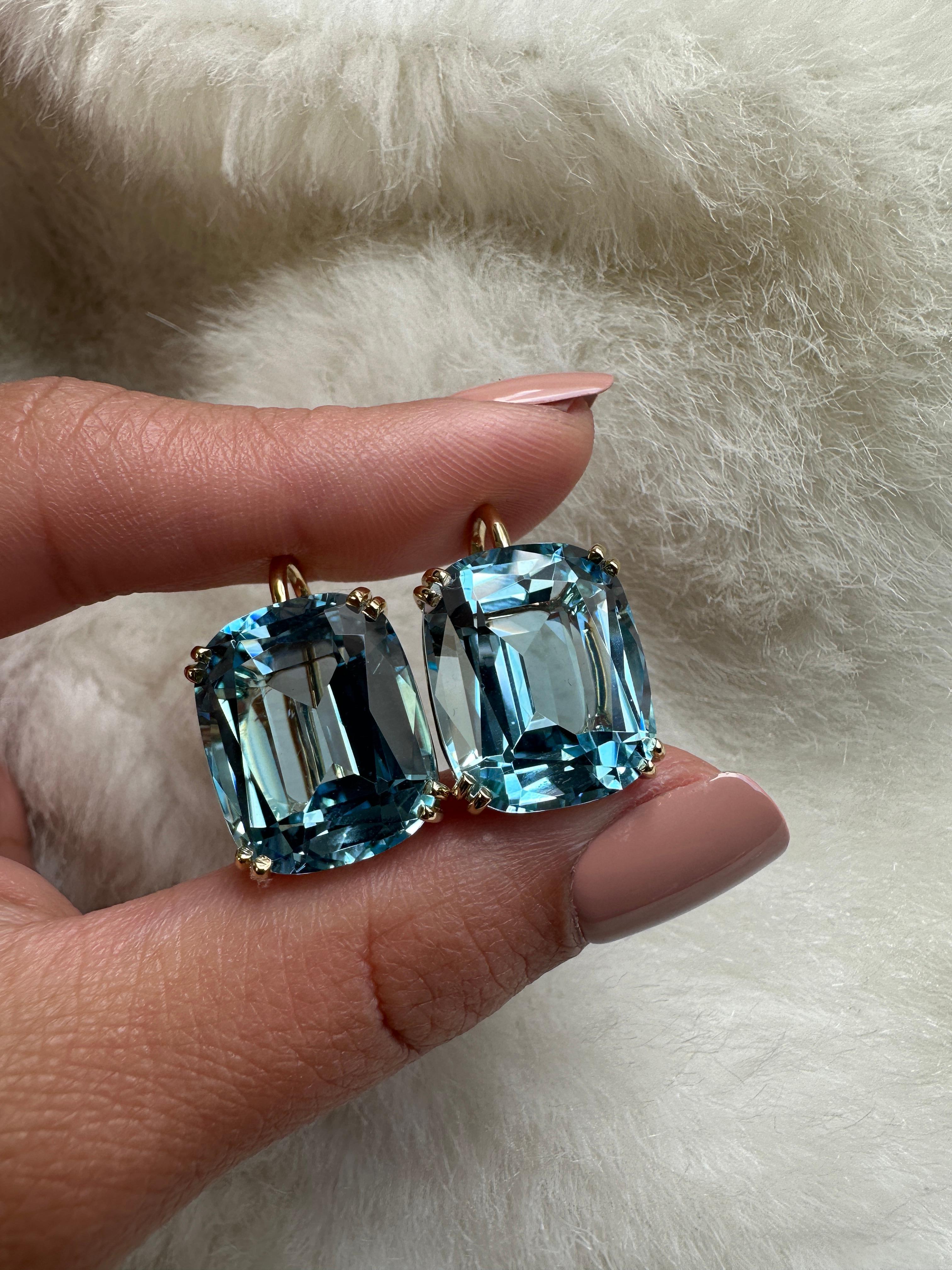 These Blue Topaz Cushion Earrings on Wire, are a dazzling piece of jewelry crafted with utmost artistry and elegance. Part of our very popular 'Gossip' Collection, these earrings embody grace and sophistication.

The focal point of these earrings is