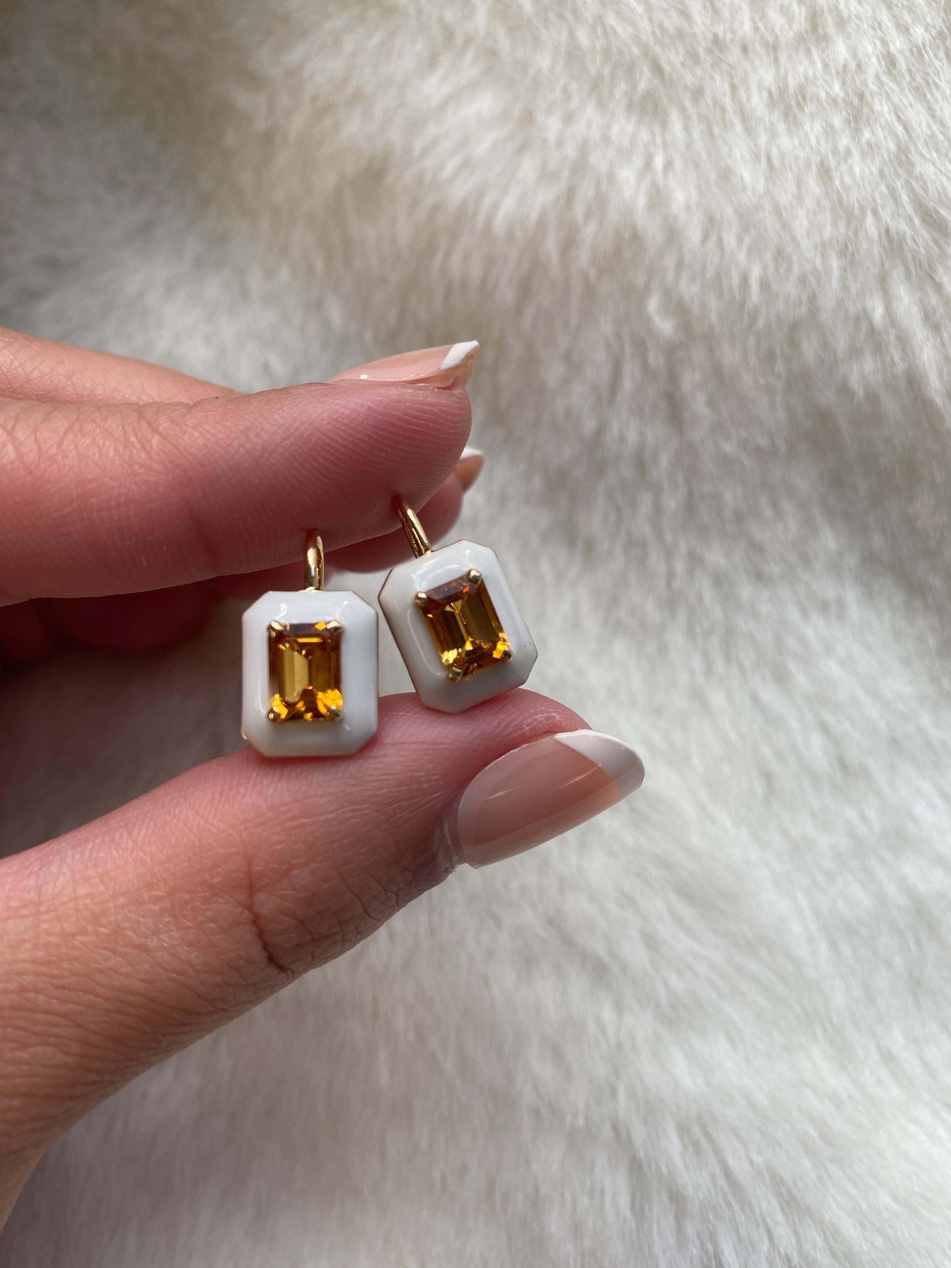 These unique earrings are a Citrine Emerald Cut, with White Enamel border and Lever back. From our ‘Queen’ Collection, it was inspired by royalty, but with a modern twist. The combination of enamel, and Citrine represents power, richness and passion