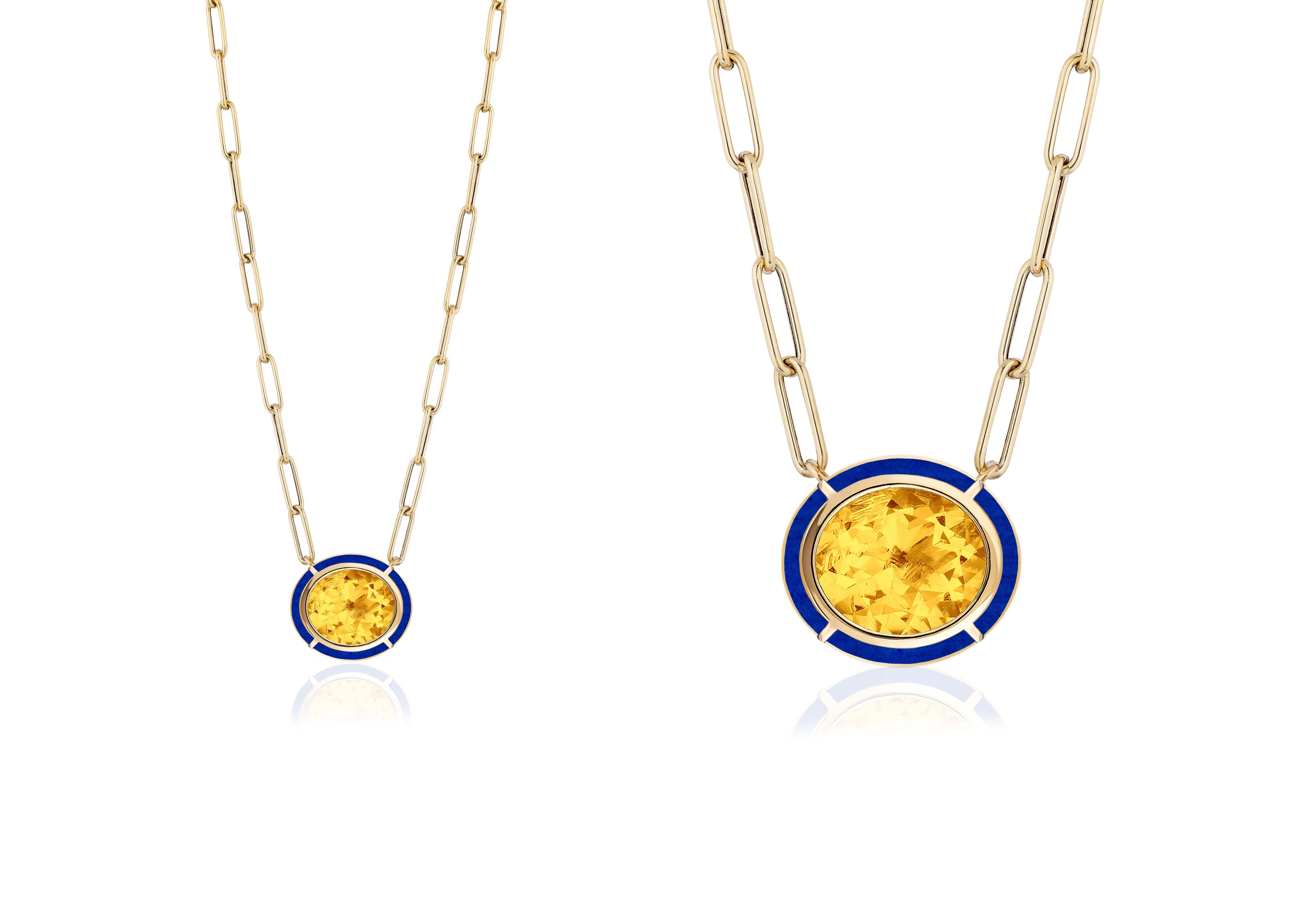 This Citrine & Lapis Lazuli Inlay Oval Pendant in 18K Yellow Gold is a stunning piece of jewelry from the 'Mélange' Collection. The pendant features an oval-shaped Citrine surrounded by a Lapis Lazuli stone, both set in 18K Yellow gold. The