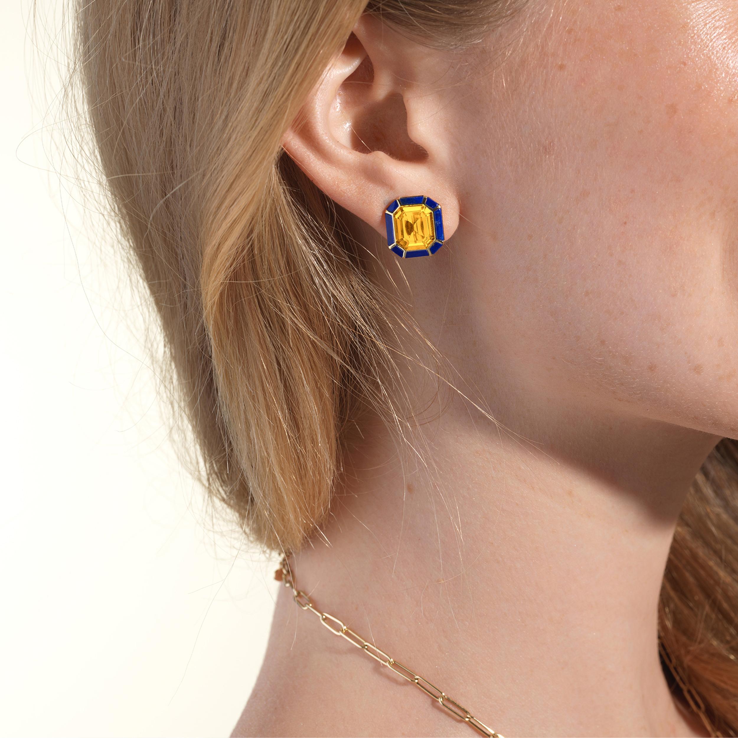 The Citrine & Lapis Lazuli Stud Earrings from the 'Melange' Collection showcase a captivating blend of elegance and charm. Crafted with exquisite attention to detail, these earrings feature stunning emerald cut Citrine and Lapis Lazuli gemstones set