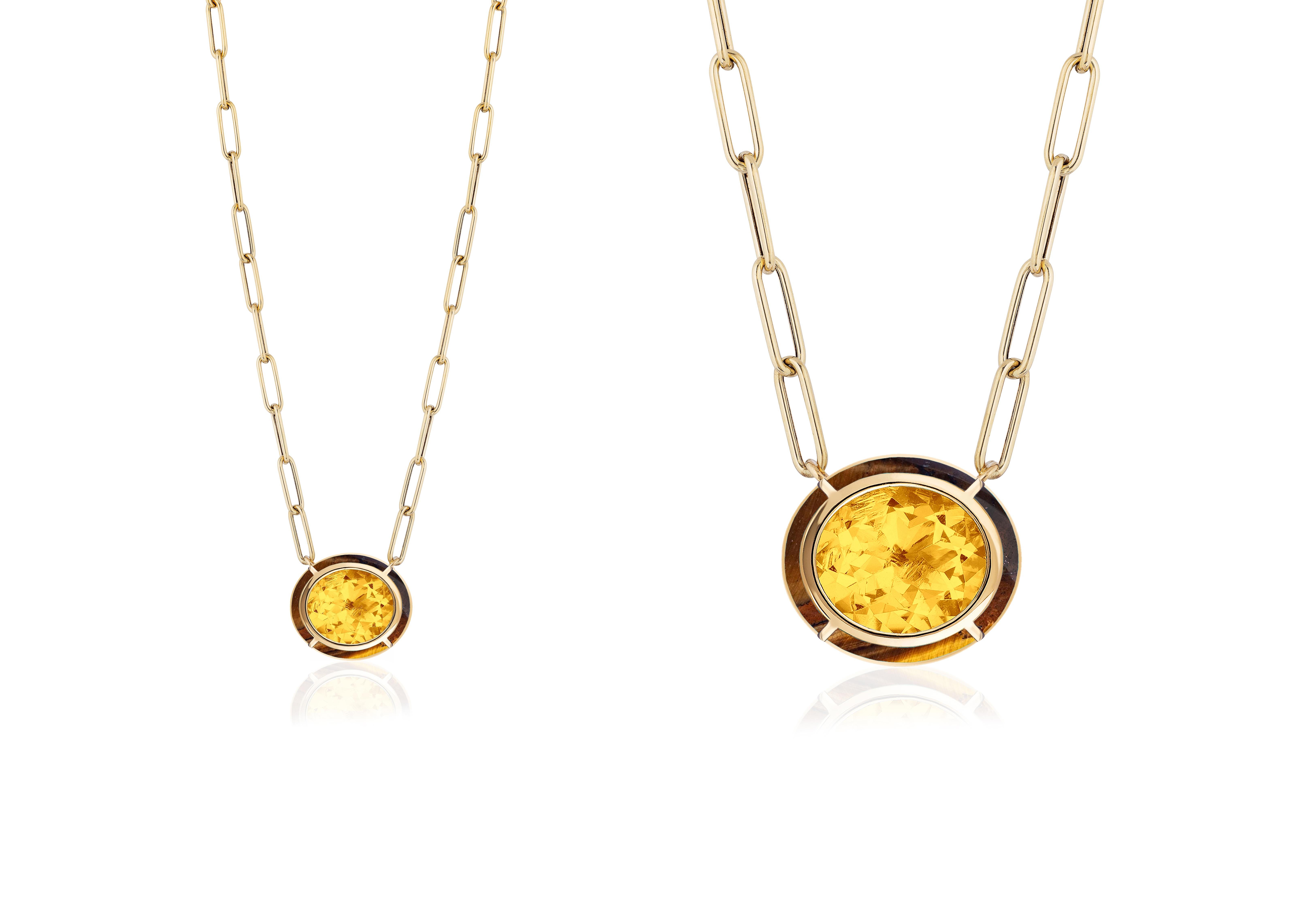 This Citrine & Tiger's Eye Inlay Oval Pendant in 18K Yellow Gold is a stunning piece of jewelry from the 'Mélange' Collection. The pendant features an oval-shaped Citrine surrounded by a Tiger's Eye stone, both set in 18K Yellow gold. The