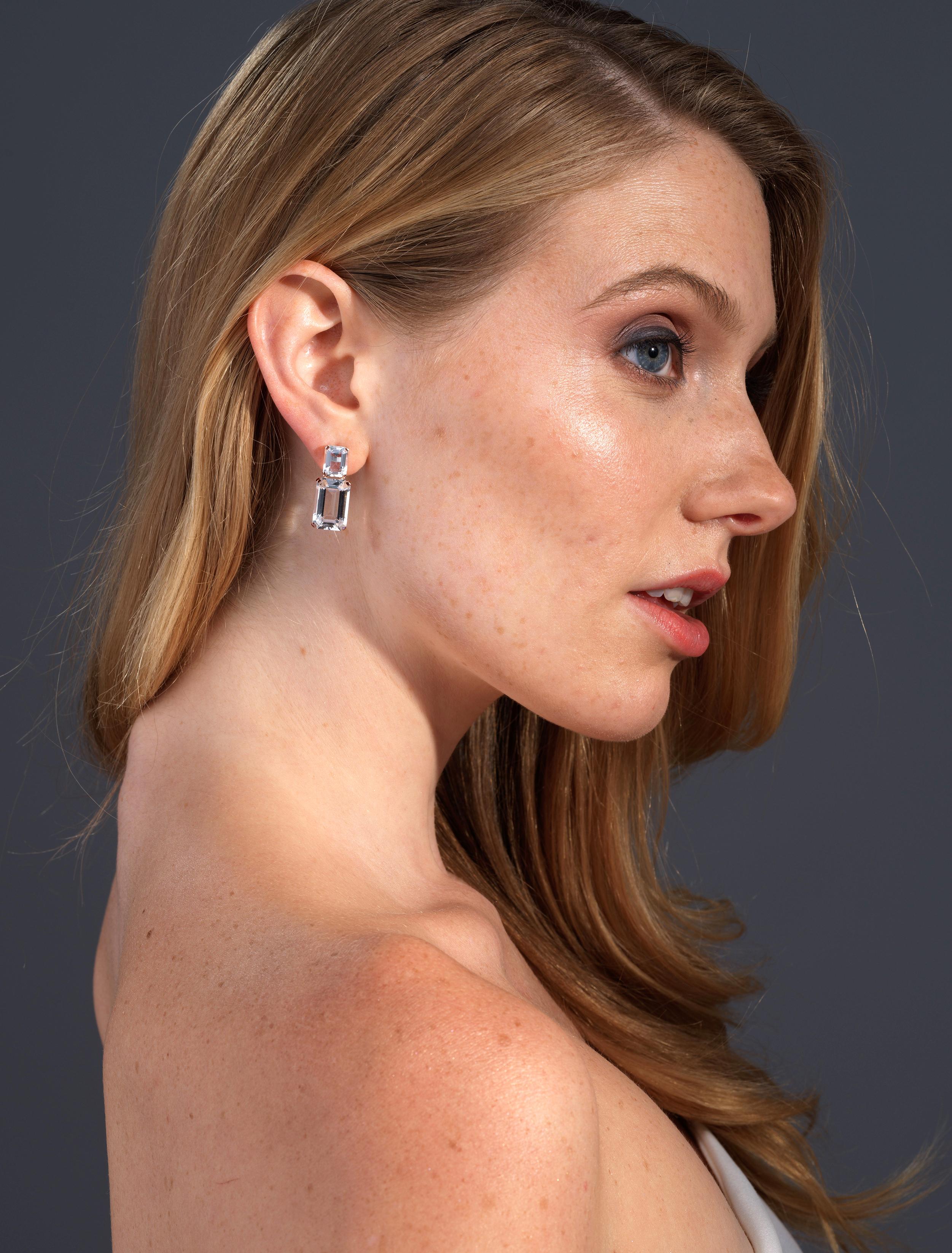 These Rock Crystal Emerald Cut Earrings in 18K Rose Gold from the 'Gossip' Collection are a stunning and unique accessory. The clear, transparent beauty of the rock crystal, combined with the elegant emerald cut design, creates a timeless and