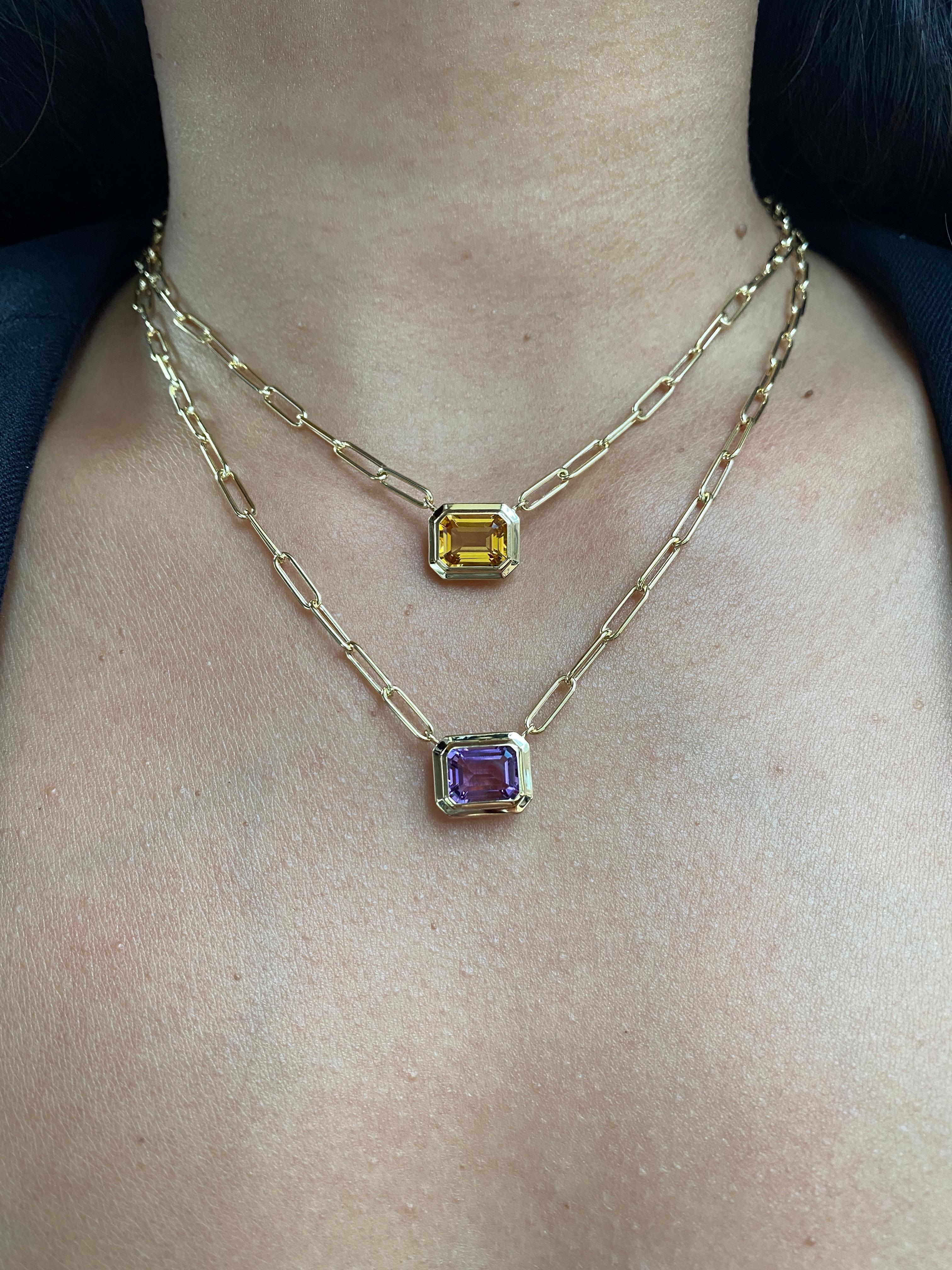This beautiful East- West Amethyst Emerald Cut Bezel Set Pendant set in 18K Yellow Gold is from our ‘Manhattan’ Collection. Minimalist lines yet bold structures are what our Manhattan Collection is all about. Our pieces represent the famous skyline