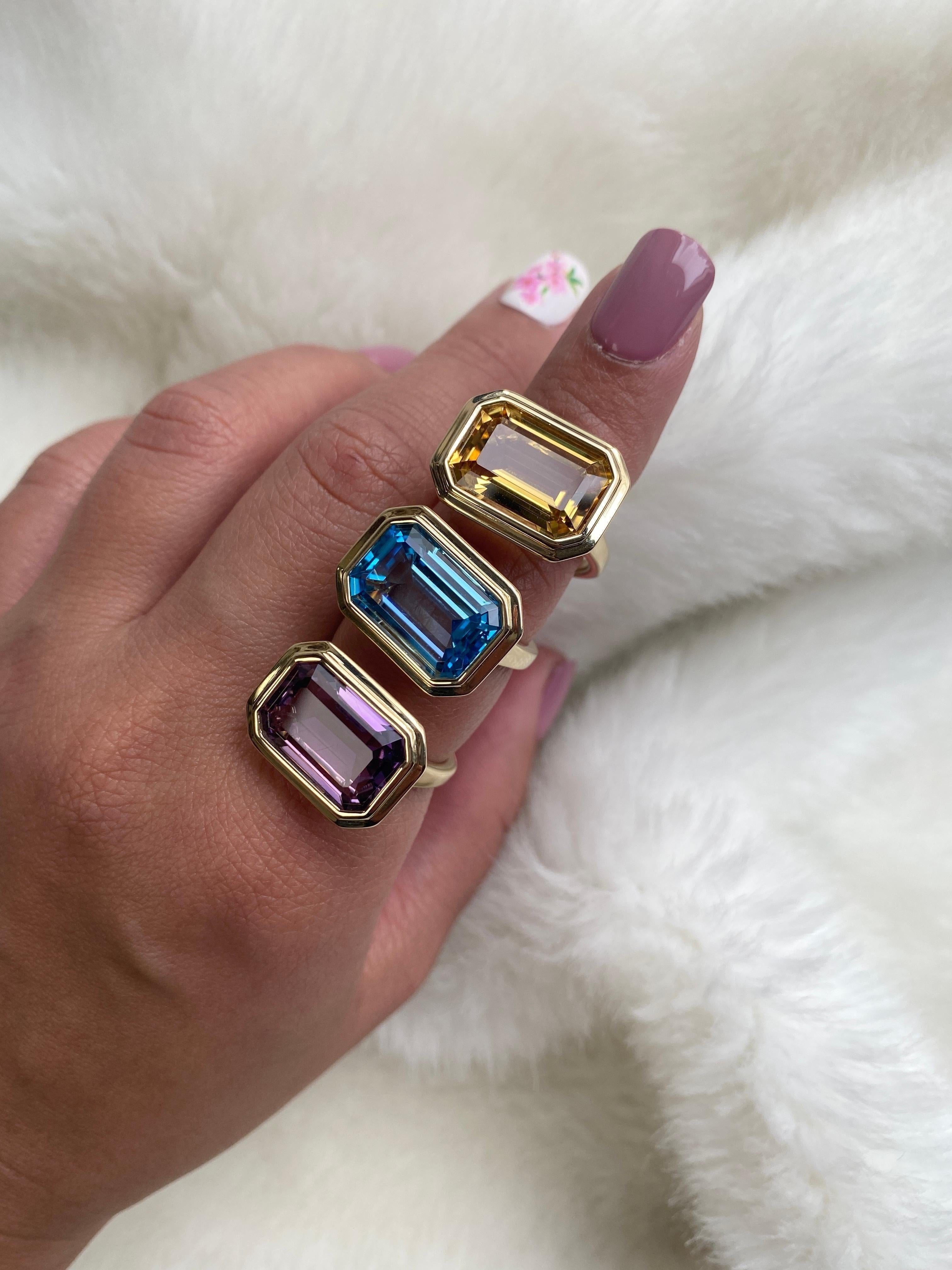 East-West Amethyst Emerald Cut Bezel Set Ring in 18K Yellow Gold, from 'Manhattan' Collection.  Minimalist lines yet bold structures is what our Manhattan Collection is all about. Our pieces represent the famous skyline and cityscapes of New York
