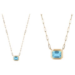 Goshwara East-West Blue Topaz Emerald Cut Bezel Set Pendant