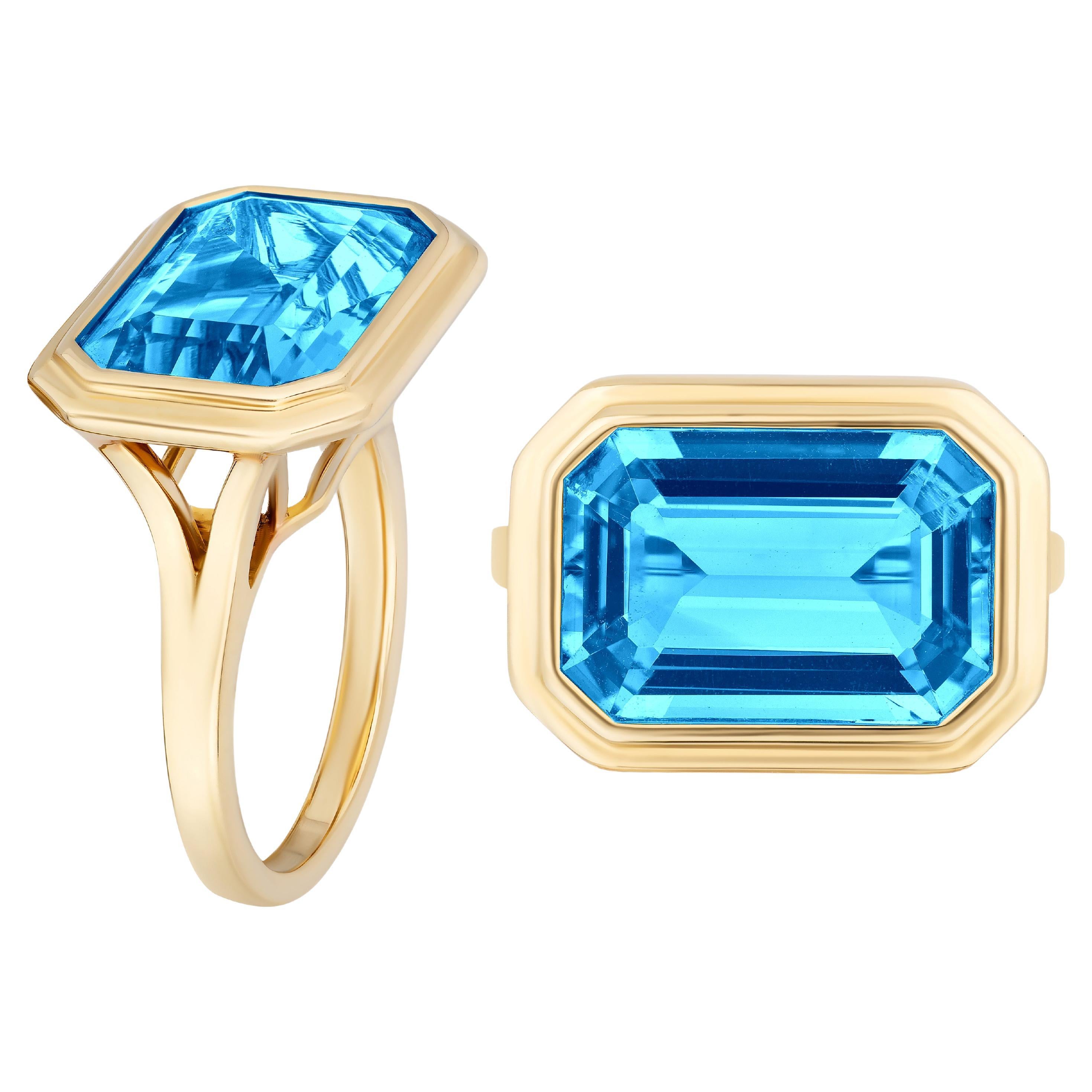 Goshwara East-West Blue Topaz Emerald Cut Bezel Set Ring For Sale