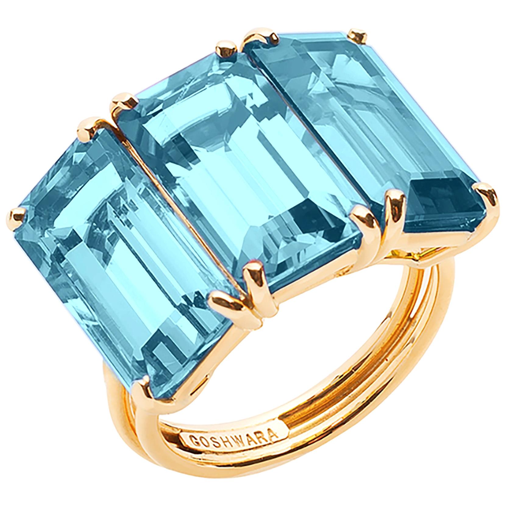 Goshwara 3-Stein-Ring mit blauem Topas im Smaragdschliff