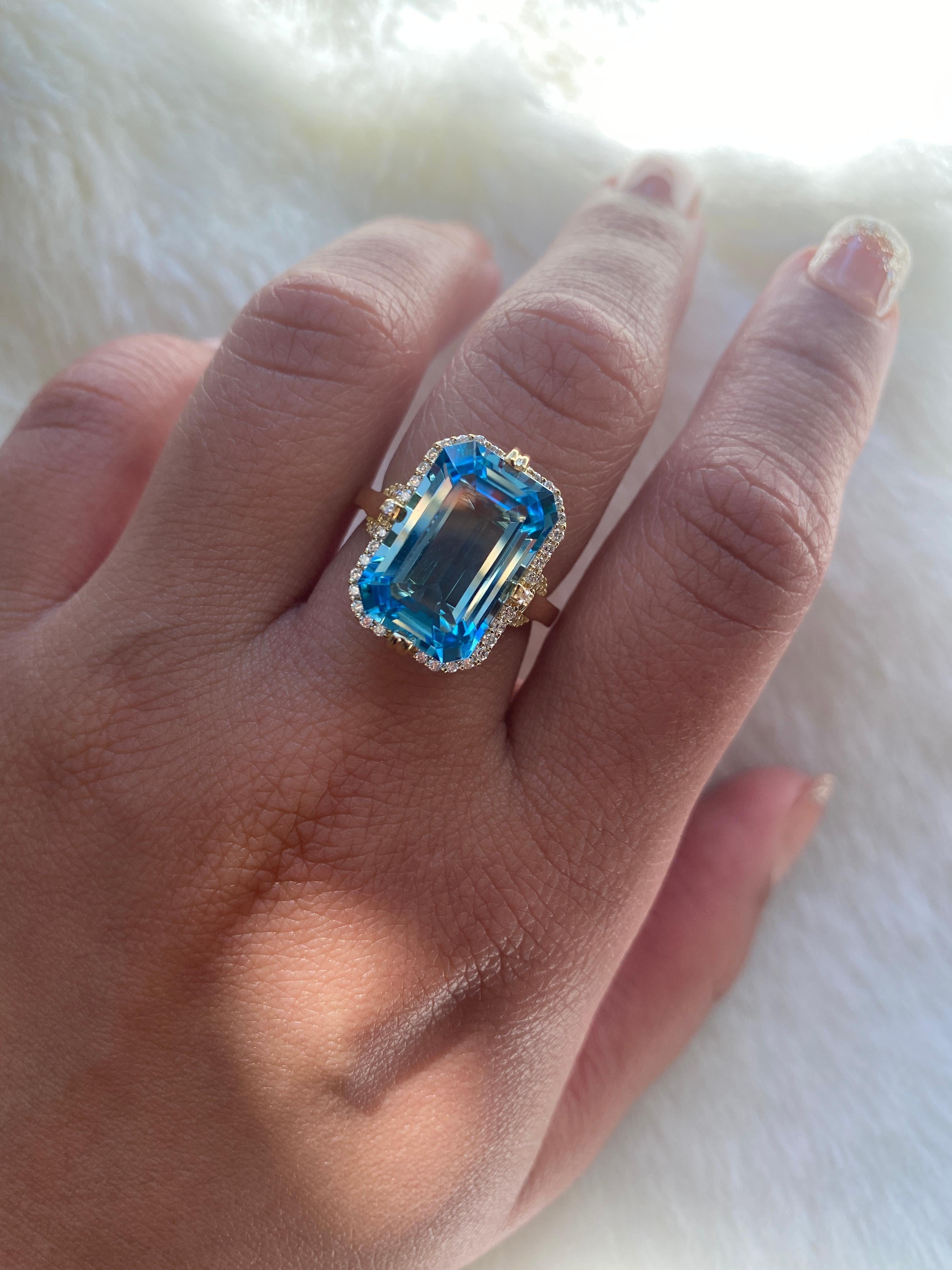 Blue Topaz Emerald Cut Ring with Diamonds in 18k  Yellow Gold, from 'Gossip' Collection

Stone Size: 10 x 15 mm

Gemstone Weight: 9.06 Carats

Diamond: G-H / VS, Approx Wt: 0.28 Carats