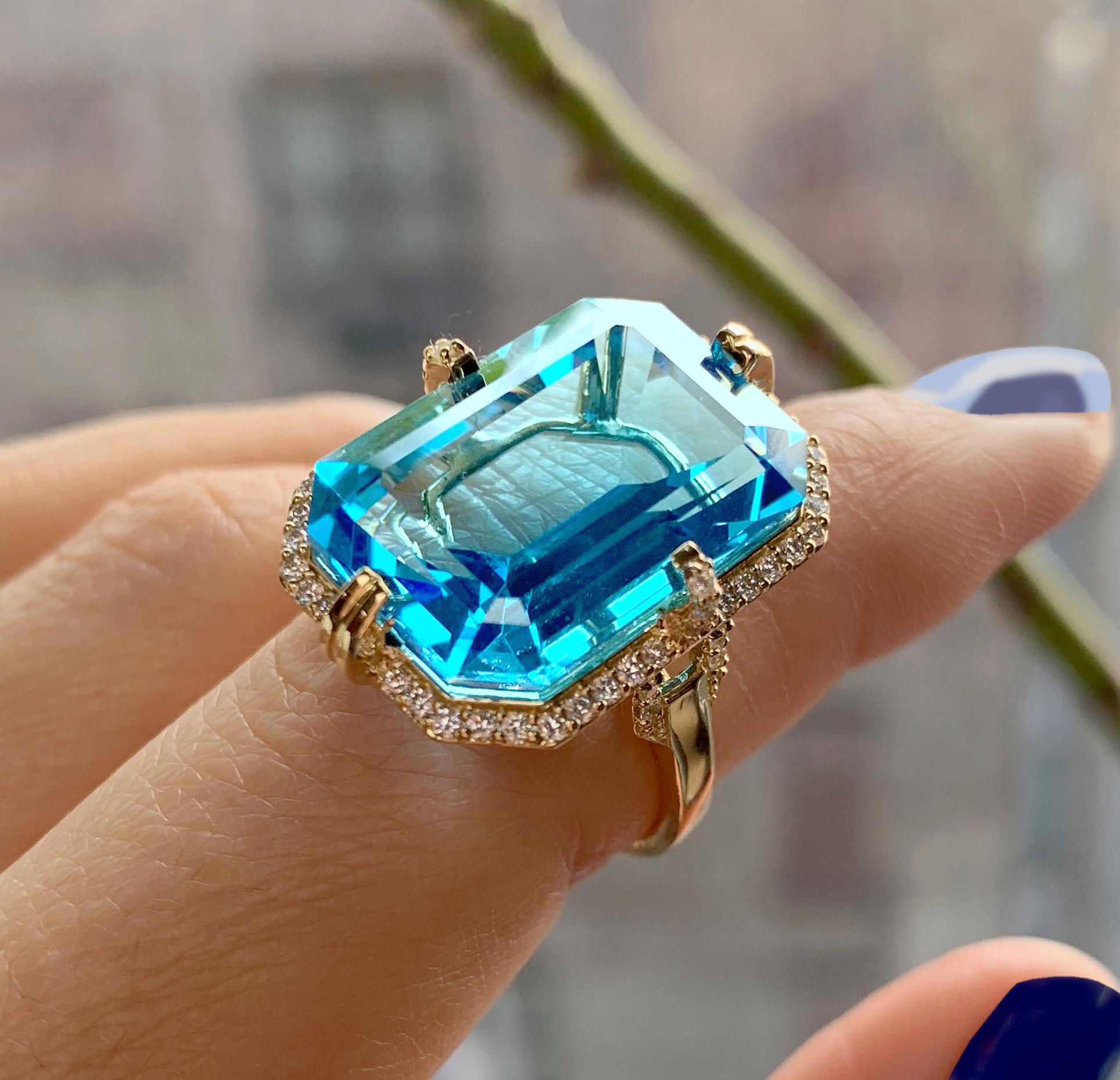 Blue Topaz Emerald Cut Ring with Diamonds in 18K Yellow Gold, from 'Gossip' Collection. Like any good piece of gossip, this collection carries a hint of shock value. They will have everyone in suspense about what Goshwara will do next.

* Gemstone