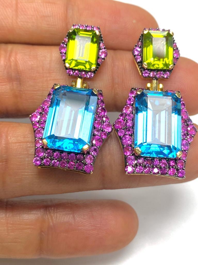 Contemporary Emerald Cut Blue Topaz and Peridot with Pink Sapphire Earrings For Sale