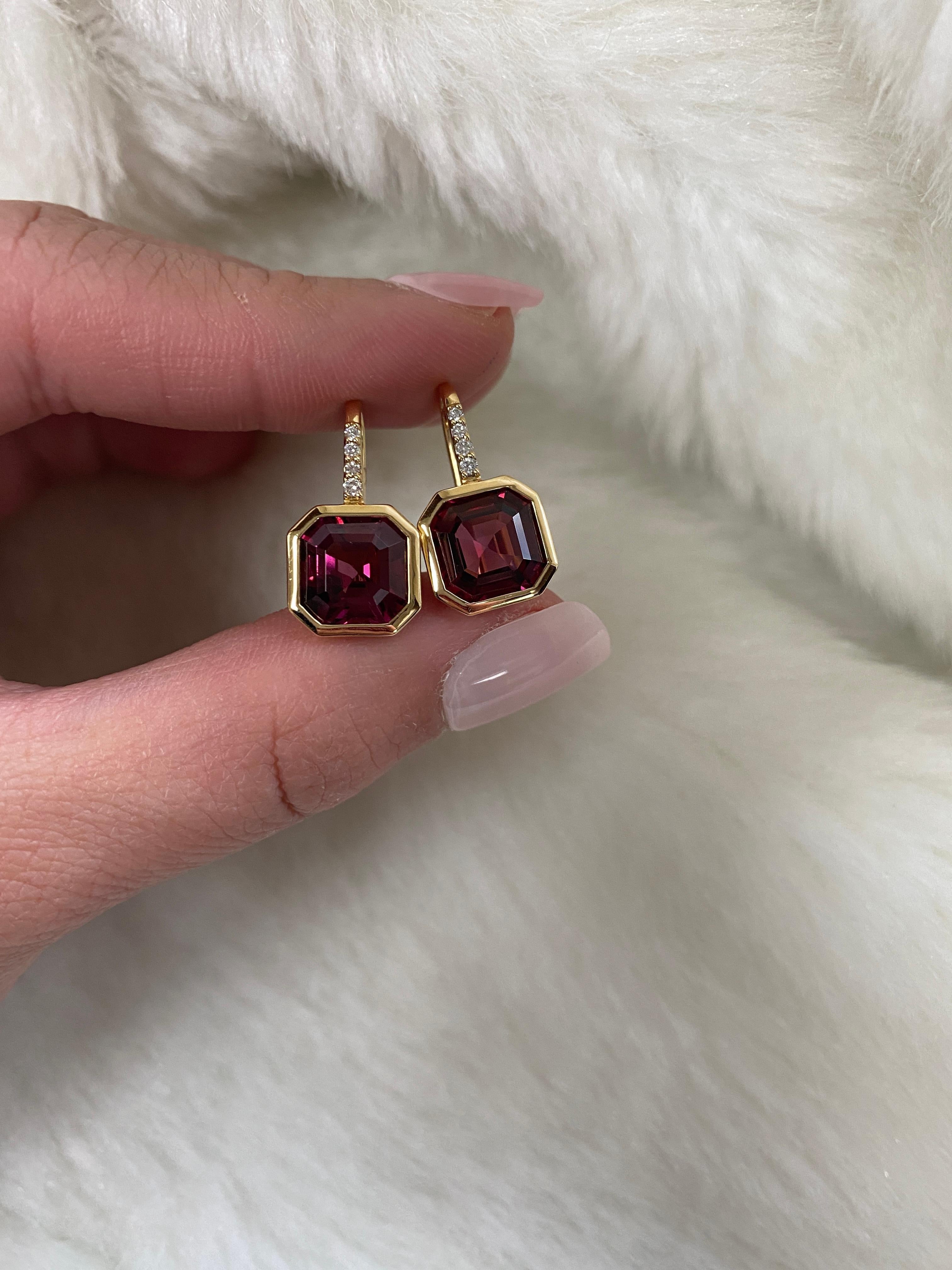 Elevate your style with these exquisite earrings featuring a stunning 9 x 9 mm Asscher-cut Garnet gemstone. Expertly set on a delicate wire of 18K Gold, these earrings are adorned with four dazzling Diamonds, adding a touch of luxury and sparkle to