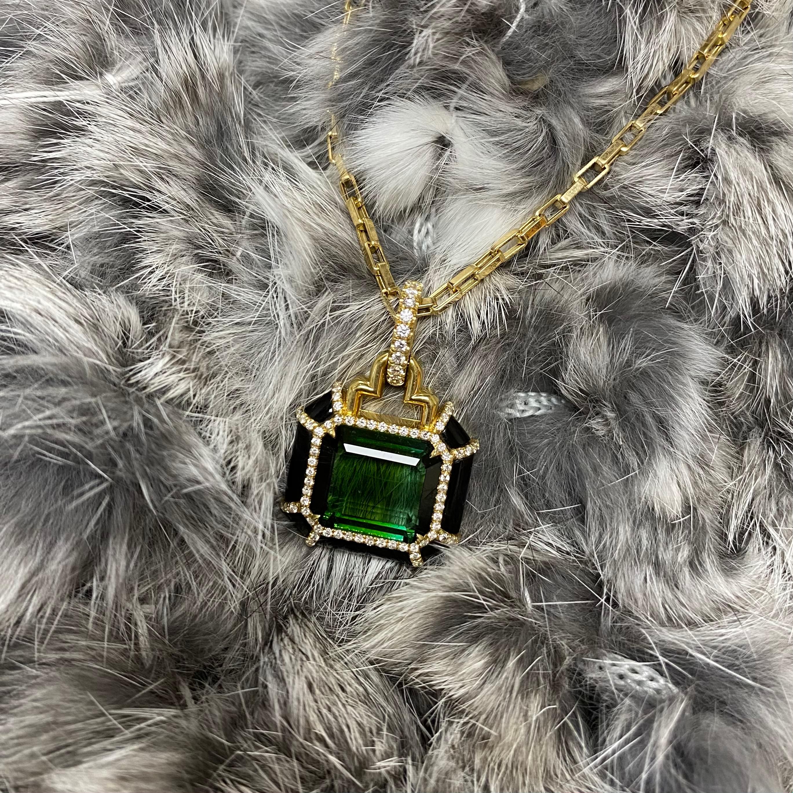 This Green Tourmaline Emerald Cut Pendant in 18K Yellow Gold with Diamonds is a stunning piece of jewelry from the 'G-One' Collection. It features a large, emerald-cut green tourmaline stone set in a high-quality 18K yellow gold pendant. The