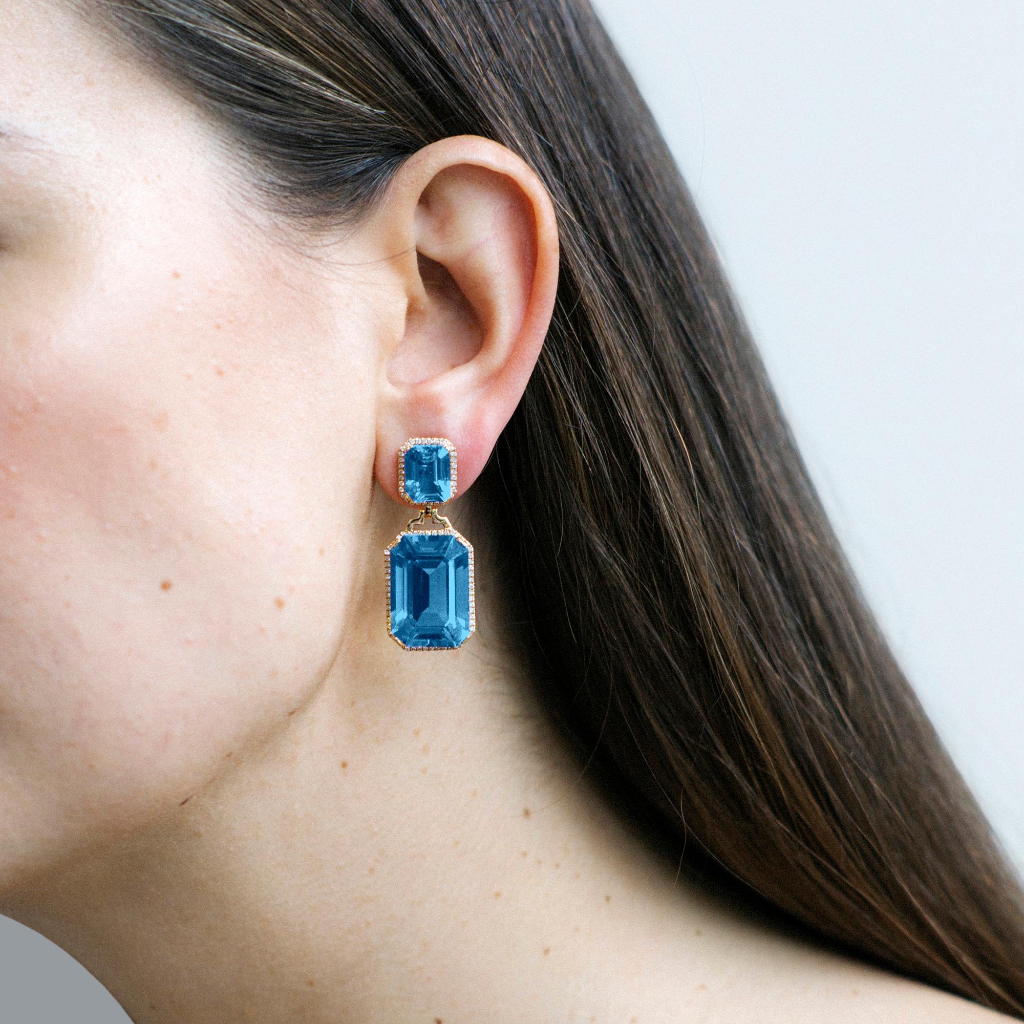 These London Blue Topaz Emerald Cut with Diamonds Earrings in 18K Yellow Gold are a stunning addition to the 'Gossip' Collection. These earrings feature beautiful London Blue Topaz gemstones with a distinctive emerald cut that is complemented by the