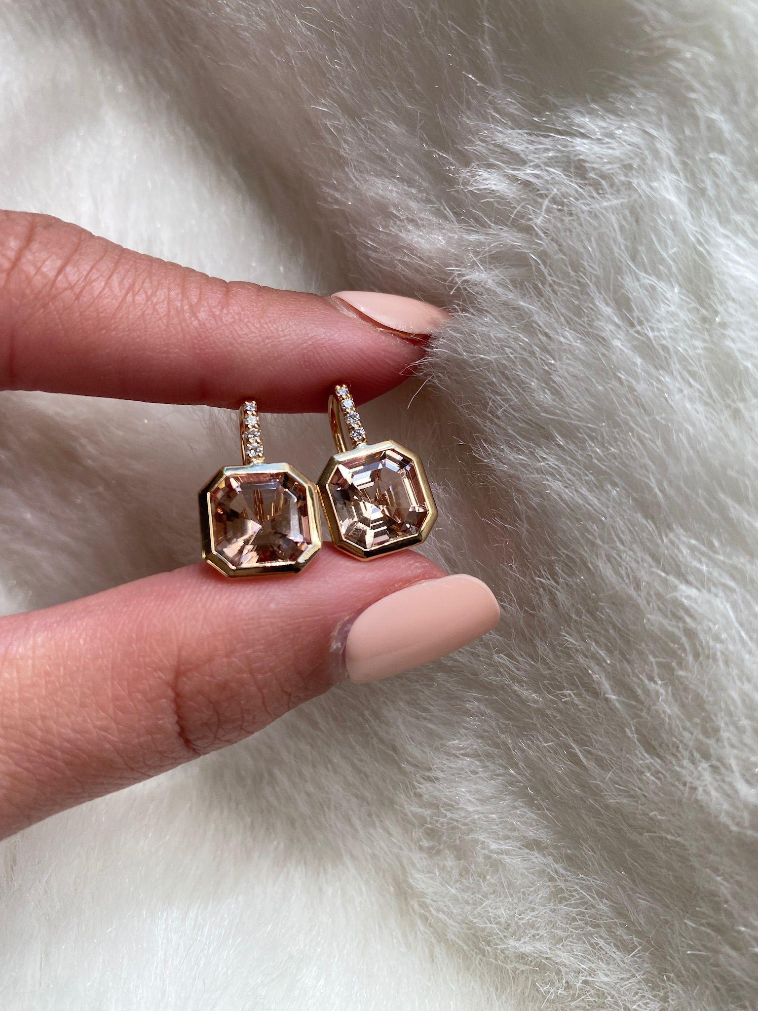 Elevate your style with these exquisite earrings featuring a stunning 9 x 9 mm Asscher-Cut Morganite gemstone. Expertly set on a delicate wire of 18K Gold, these earrings are adorned with four dazzling Diamonds, adding a touch of luxury and sparkle