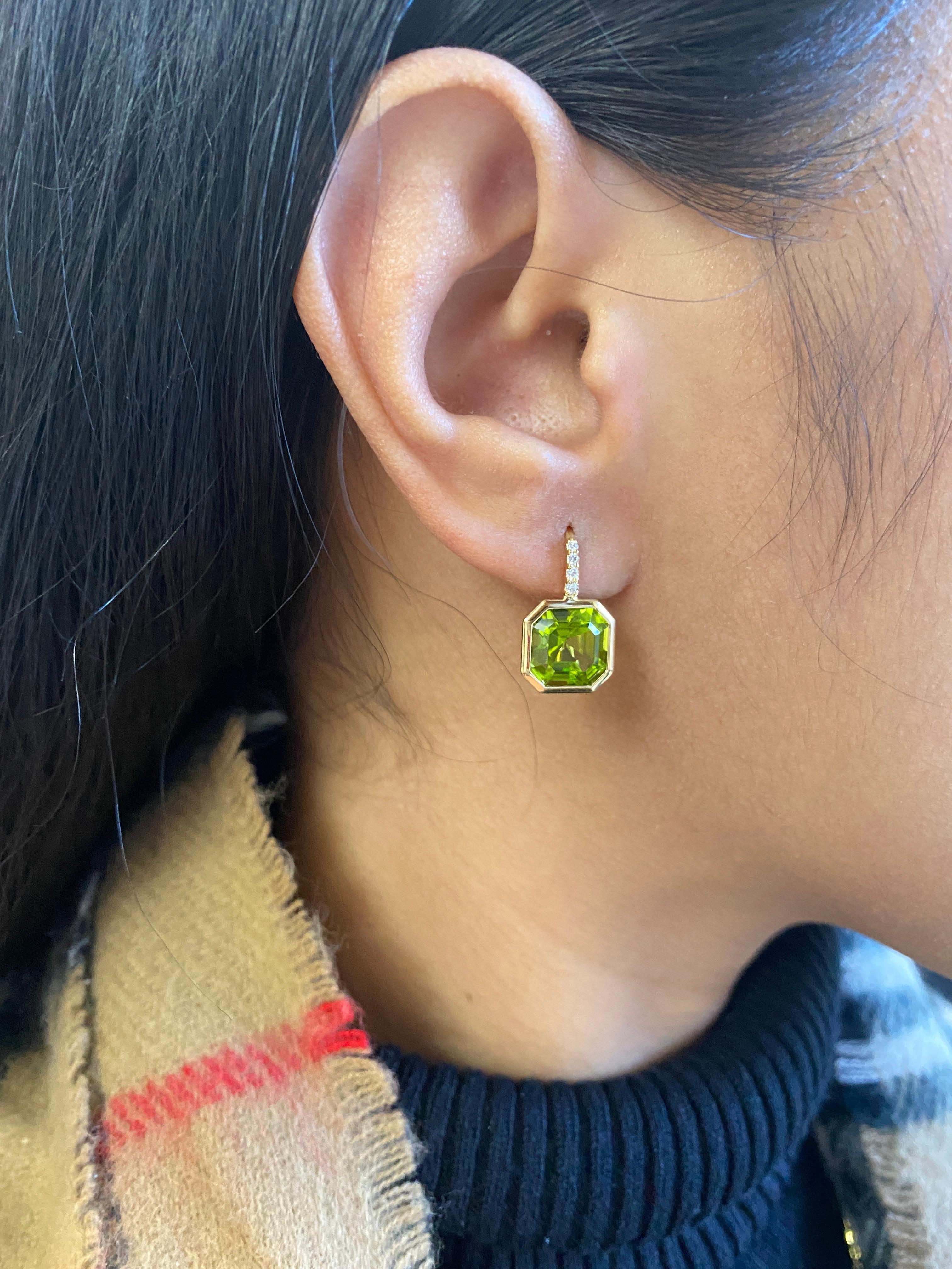 Elevate your style with these exquisite earrings featuring a stunning 9 x 9 mm Asscher-cut Peridot gemstone. Expertly set on a delicate wire of 18K Gold, these earrings are adorned with four dazzling Diamonds, adding a touch of luxury and sparkle to
