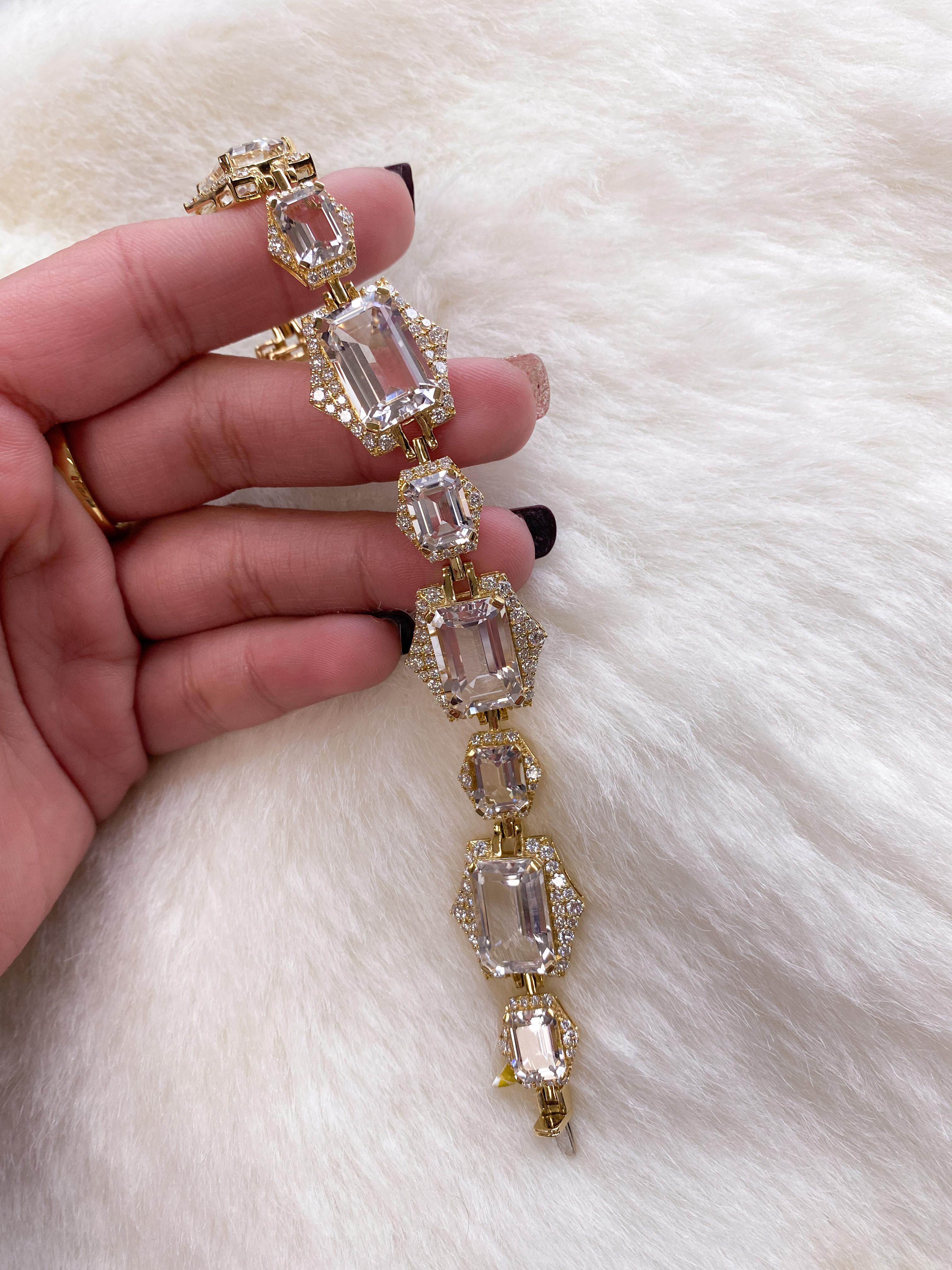 Emerald Cut Rock Crystal Bracelet with Diamonds in 18K Yellow Gold, from 'Rain-Forest' Collection

Stone size: 15 x 10 & 9 x 7 mm

Approx. gemstone Wt: 44.67 Carats (Rock Crystal)

Diamonds: G/H / VS, Approx. Wt: 4.52 Carats
