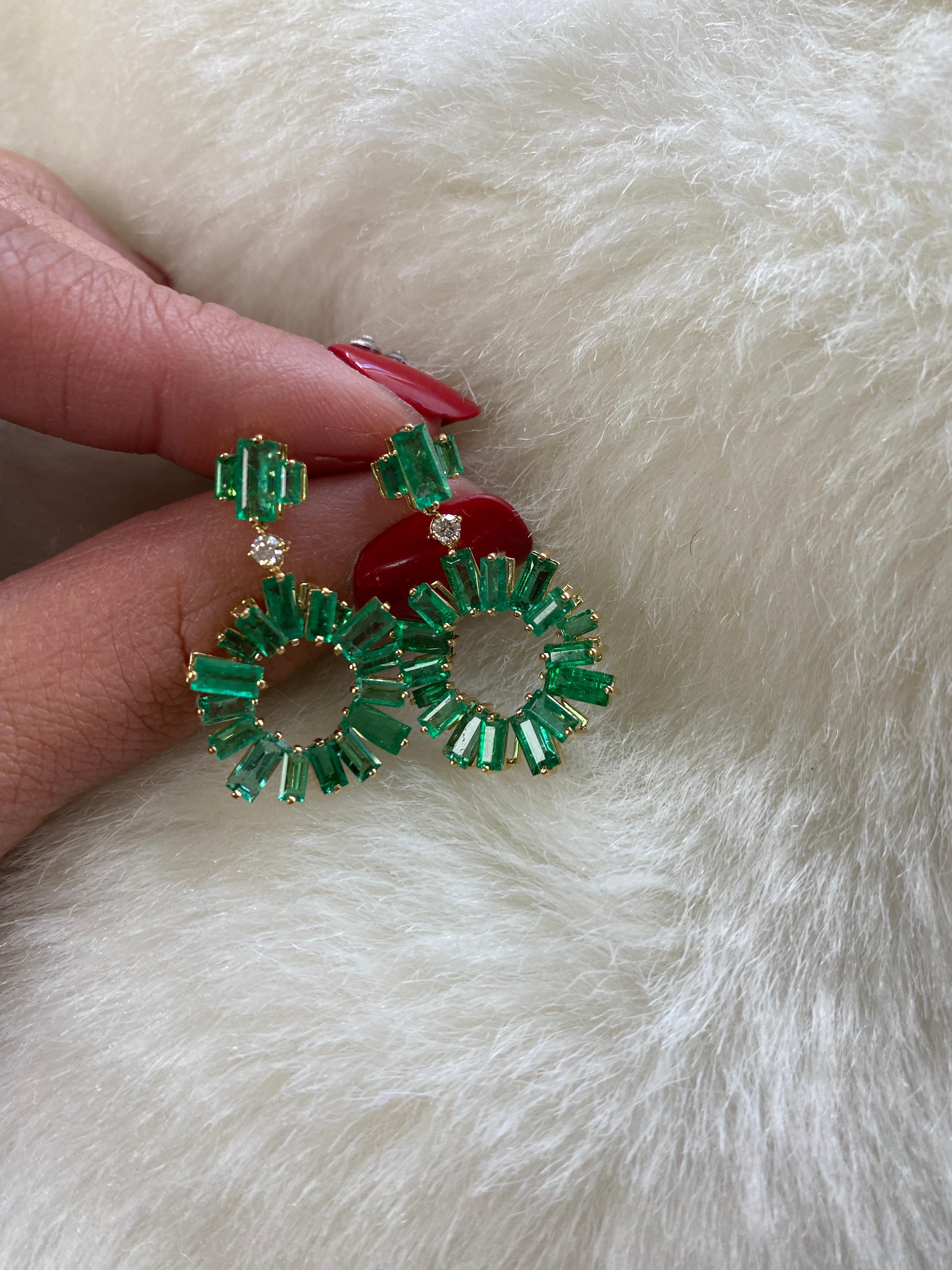 These Emerald Fancy Baguettes Earrings with Diamonds from the 'G-One' Collection are a stunning addition to any jewelry collection. Made of 18K yellow gold, these earrings feature beautiful emerald baguettes and diamonds that are delicately set to