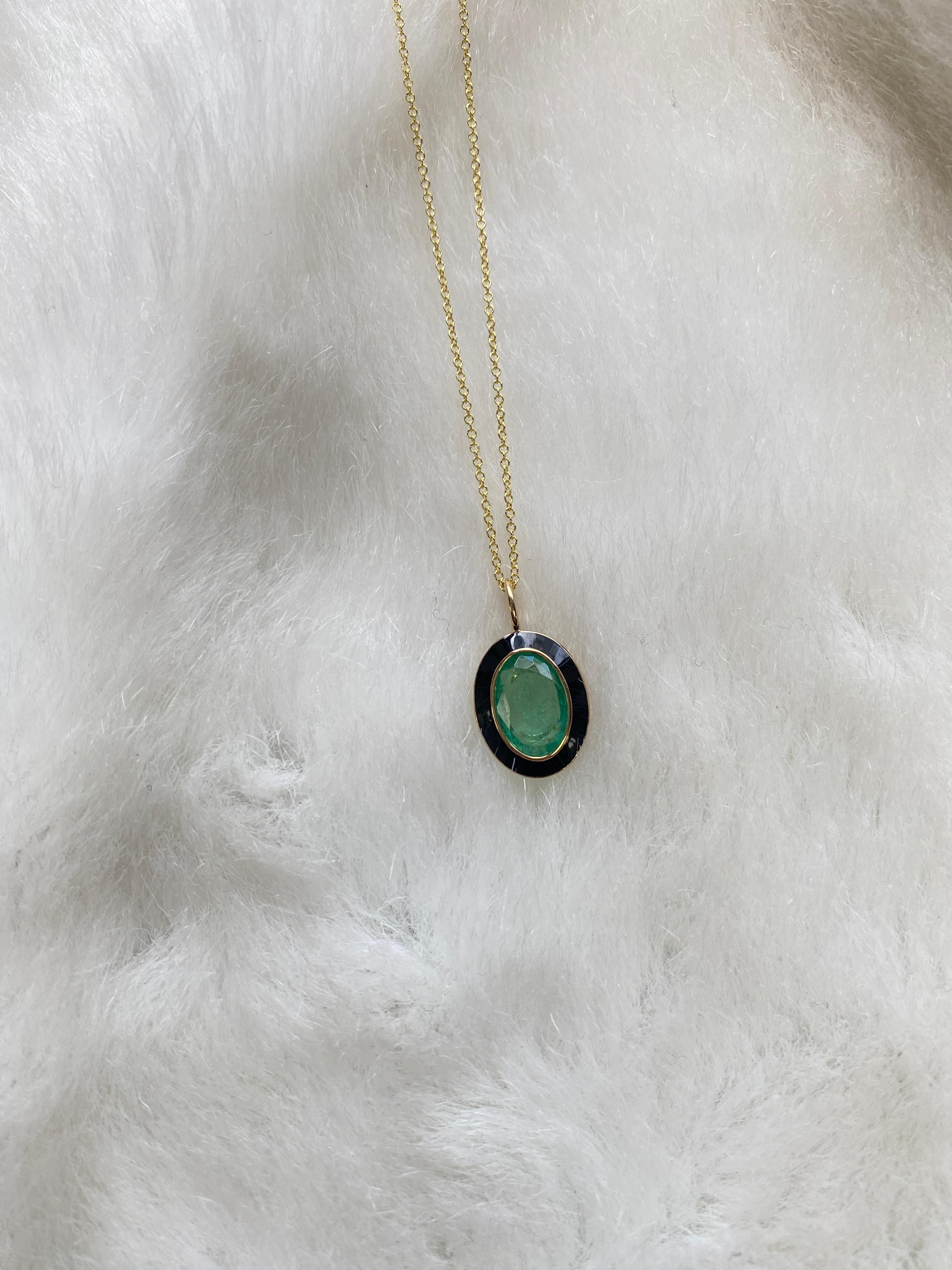 Emerald Oval Pendant with Black Enamel in 18K Yellow Gold, from 'Queen' Collection. The combination of enamel, and Emerald represents power, richness and passion of a true Queen. The feeling of luxury is what we’re aiming for, but at a price point