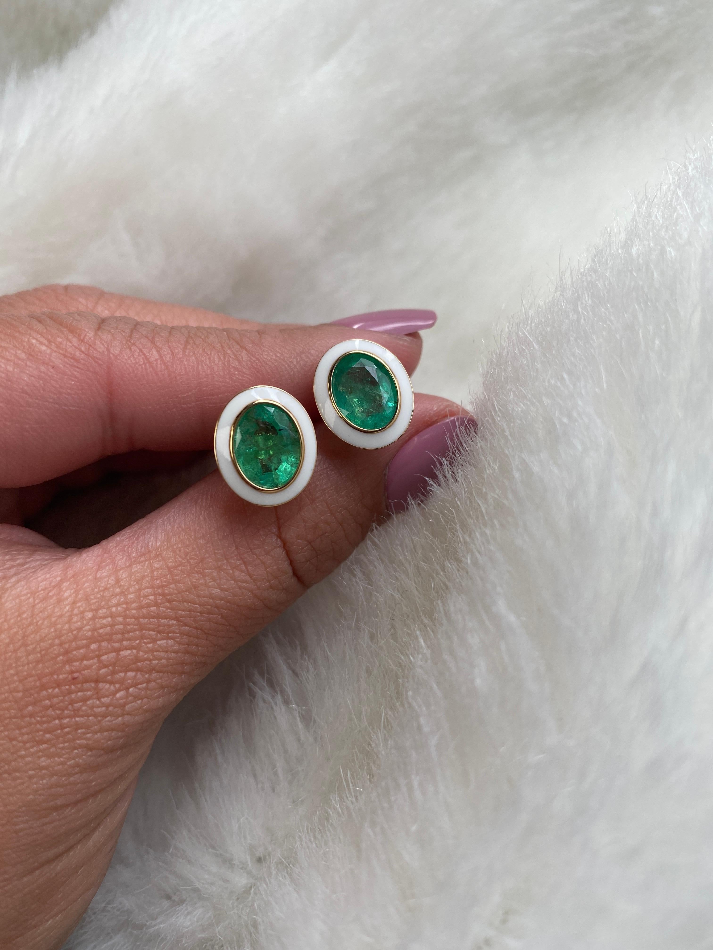 Emerald Oval Studs with White Enamel in 18K Yellow Gold, from 'Queen' Collection. The combination of enamel, and Emerald represents power, richness and passion of a true Queen. The feeling of luxury is what we’re aiming for, but at a price point