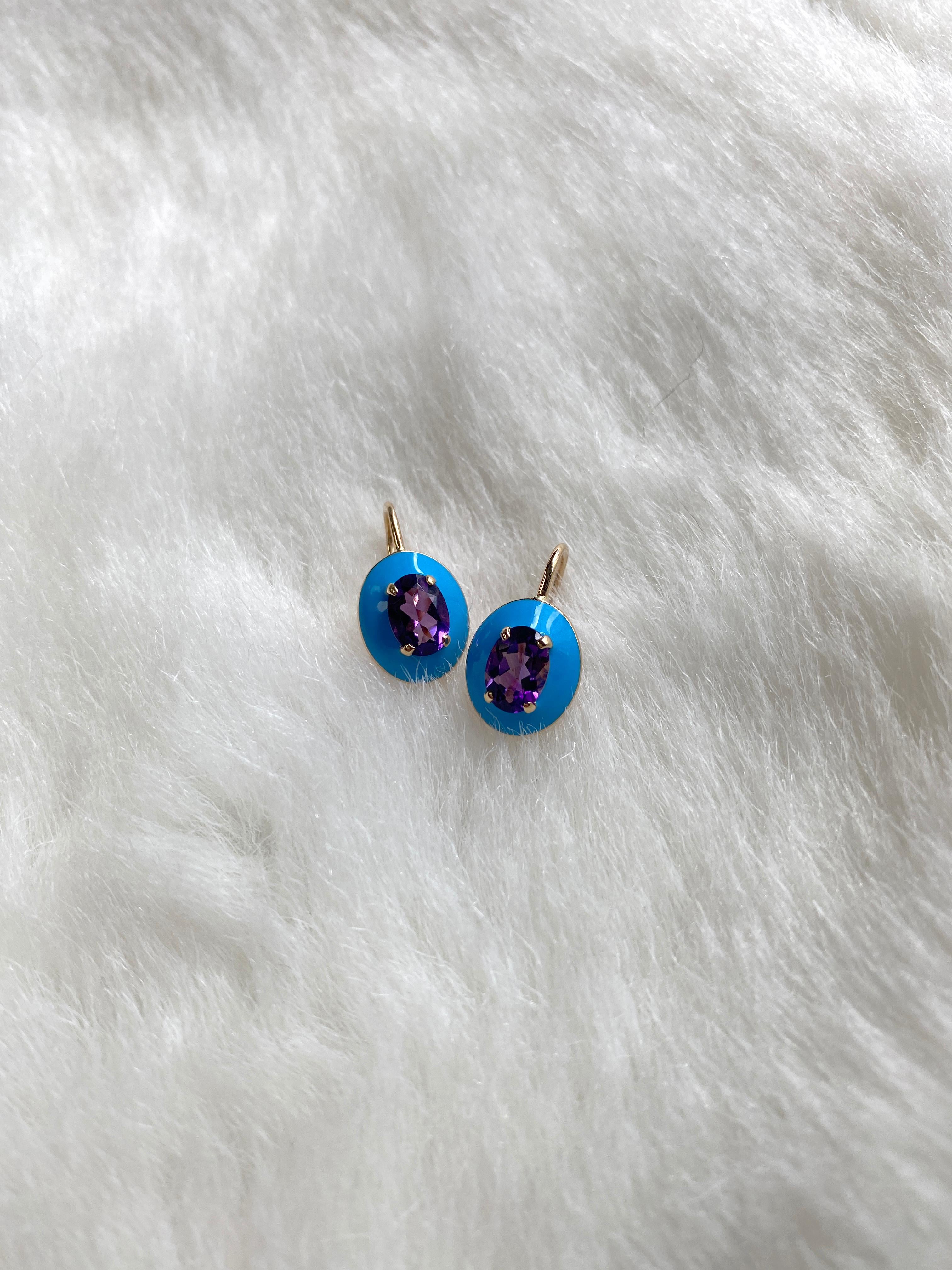 These unique earrings are a Faceted Oval Amethyst, with Turquoise Enamel border and Lever back. From our ‘Queen’ Collection, it was inspired by royalty, but with a modern twist. The combination of enamel, and Amethyst represents power, richness and
