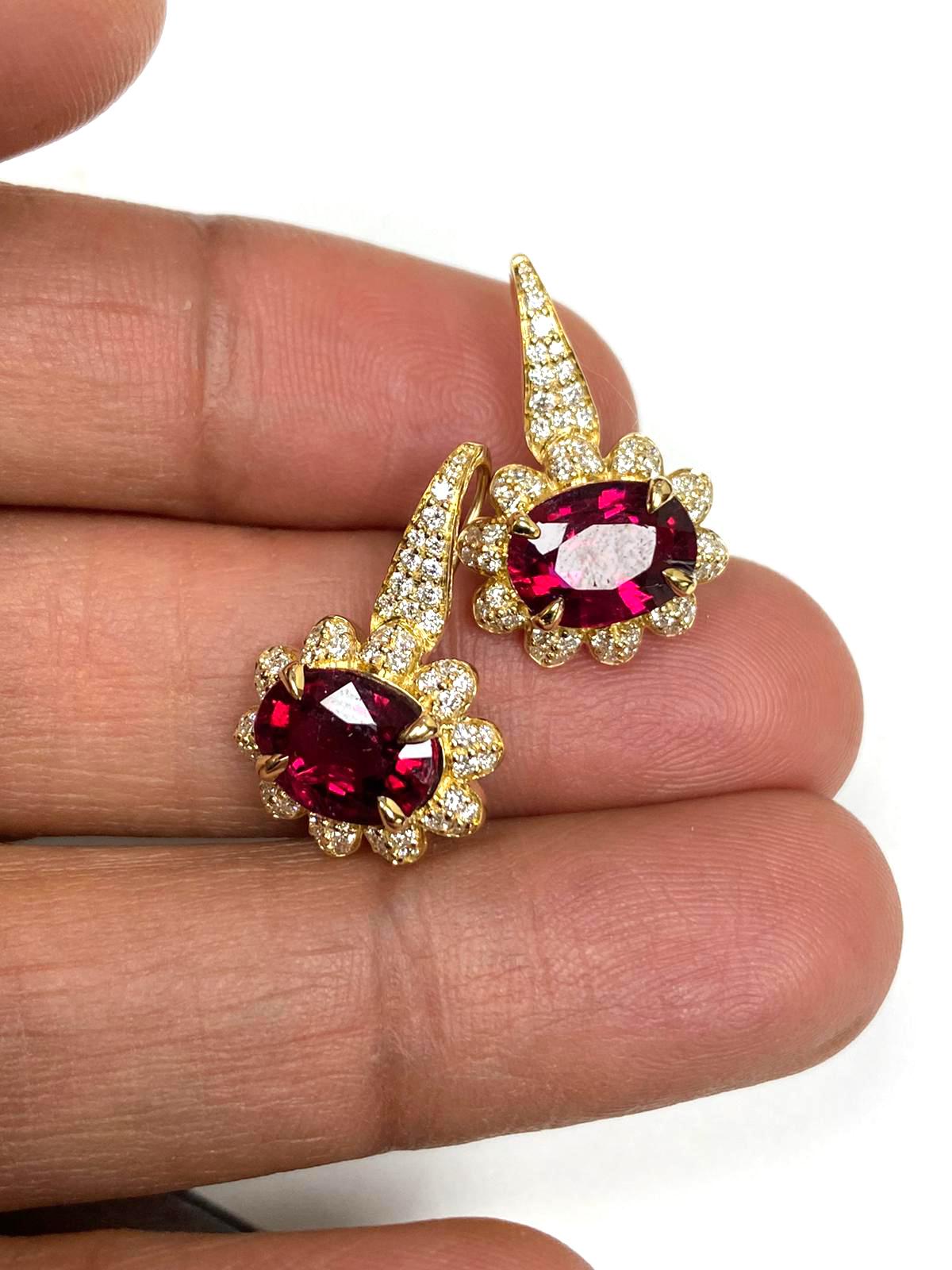 Faceted Oval Rubellite Earrings with Diamonds And Lever Back in 18K Yellow Gold, from 'G-One' Collection

Stone Size: 9.2 x 6.8 mm

Approx. Stone Wt: 3.36 Carats (Rubellite)

Diamonds: G-H / VS, Approx. Wt: 0.60 Carats
